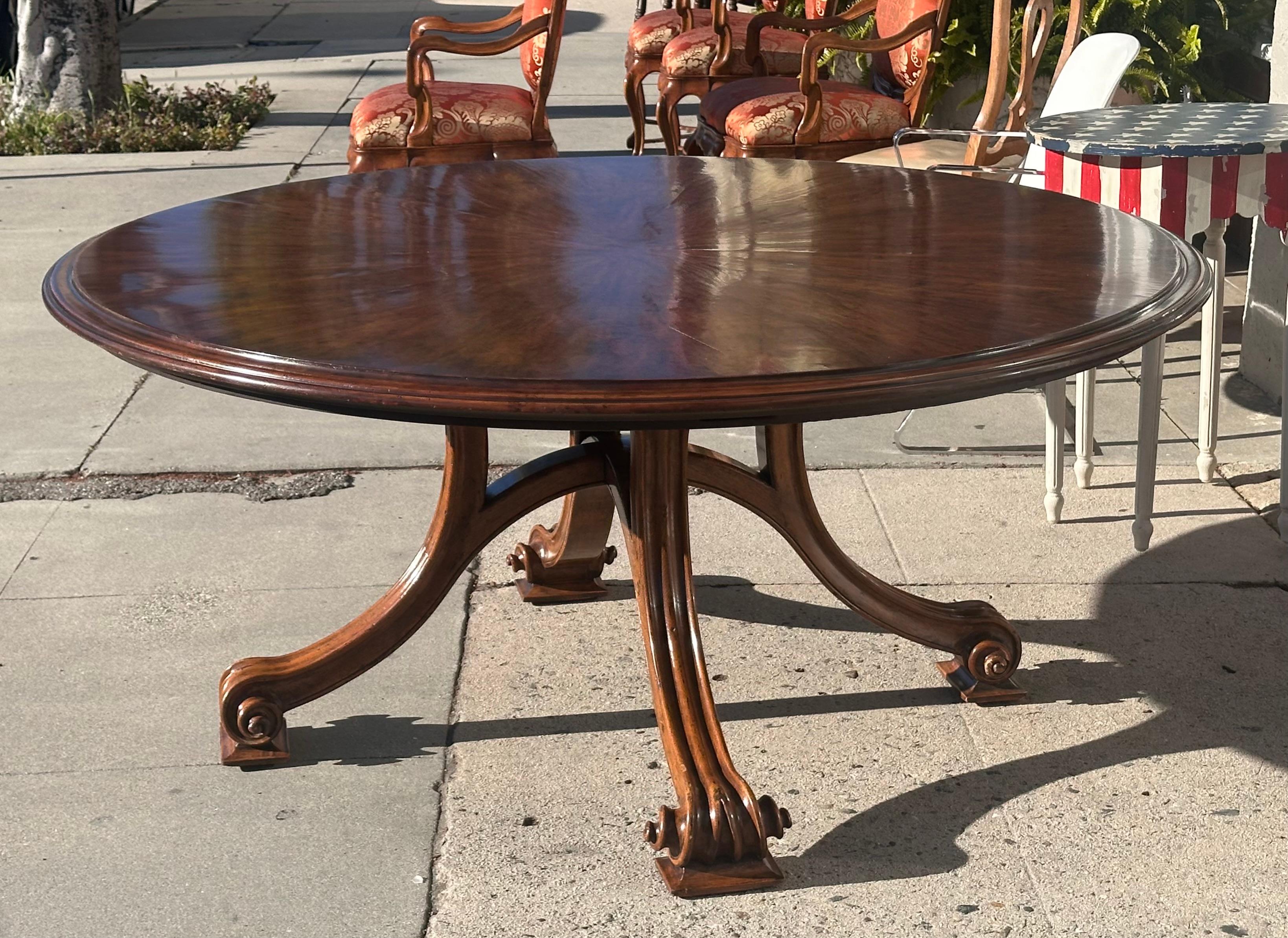 18th C Style Therien Volute Round Extension Dining Table. If features 5 unusual exterior leaves that extend the table from 66 inches diameter to 104 inches diameter round.