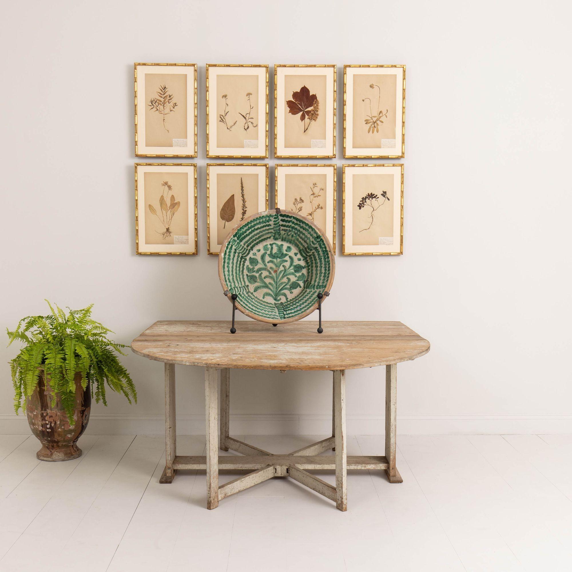 A rare Swedish gate leg or drop leaf table from the Gustavian period in original paint, circa 1780. A very practical piece with two large leaves each supported by double gates. When not needed, the leaves drop down out of the way, making a narrow