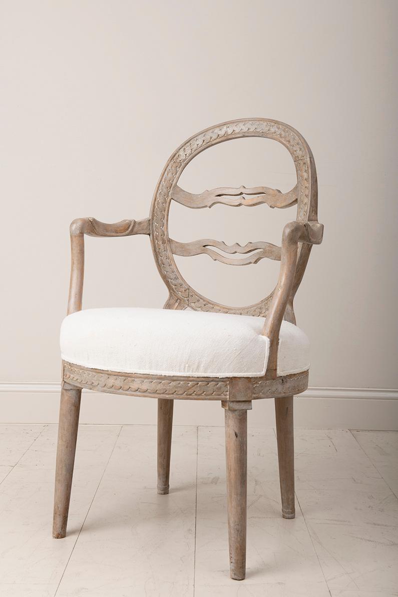 A rare 18th c. Swedish 'Laughing' Chair from the Gustavian period in original patina, newly upholstered. Named a laughing chair, because the chair back resembles a laughing mouth. This a Maison & Co. favorite! The seat frame and back are beautifully