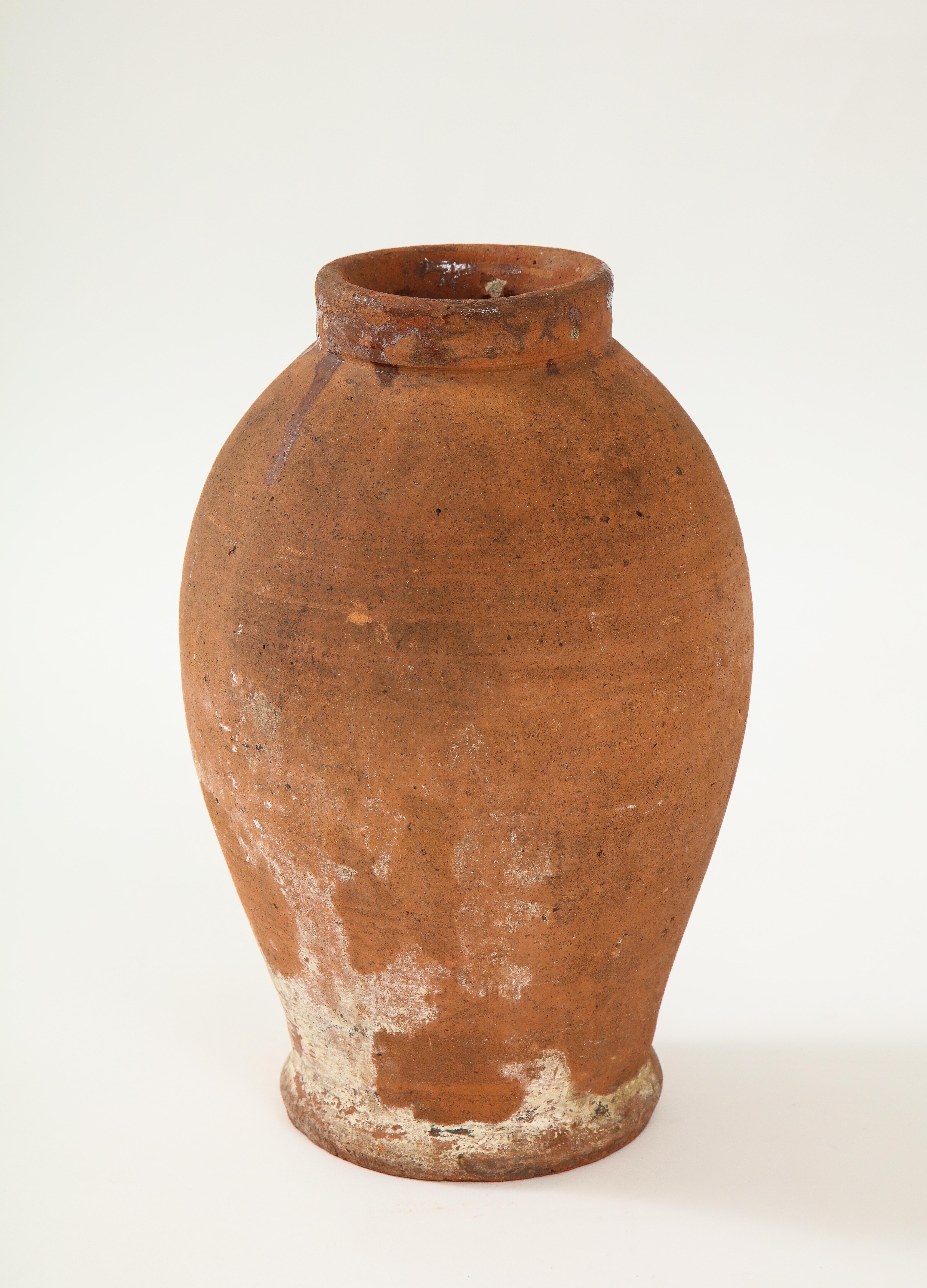 Elegantly shaped rustic unglazed terracotta storage vessel/jar from Holland.