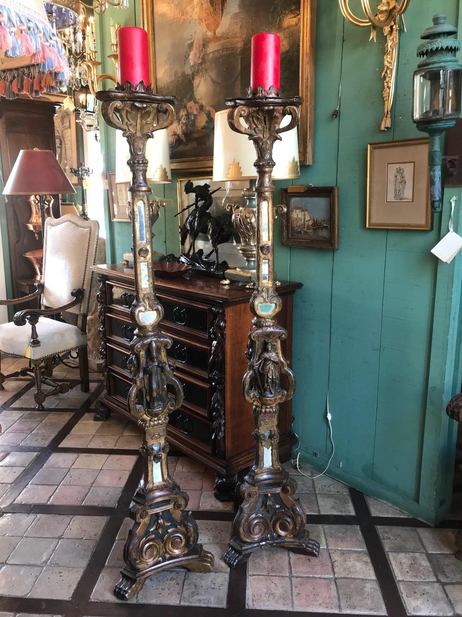 Venetian Carved Giltwood light Torchiere Candleholder Floor Lamp Collectible LA . Very fine and rare pair of 18th century hand carved and giltwood torches candleholder. Sitting on a tripod base with darkened and gilt wood. Very finely carved and