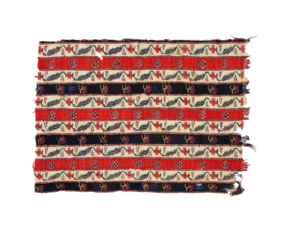 An antique Persian Iranian Safavid dynasty hand woven embroidered textile wall hanging. The textile is made in a striped design, adorned with hand embroidered floral, and foliage ornaments. Circa: 18th century. Safavid Iran or Safavid Persia, also