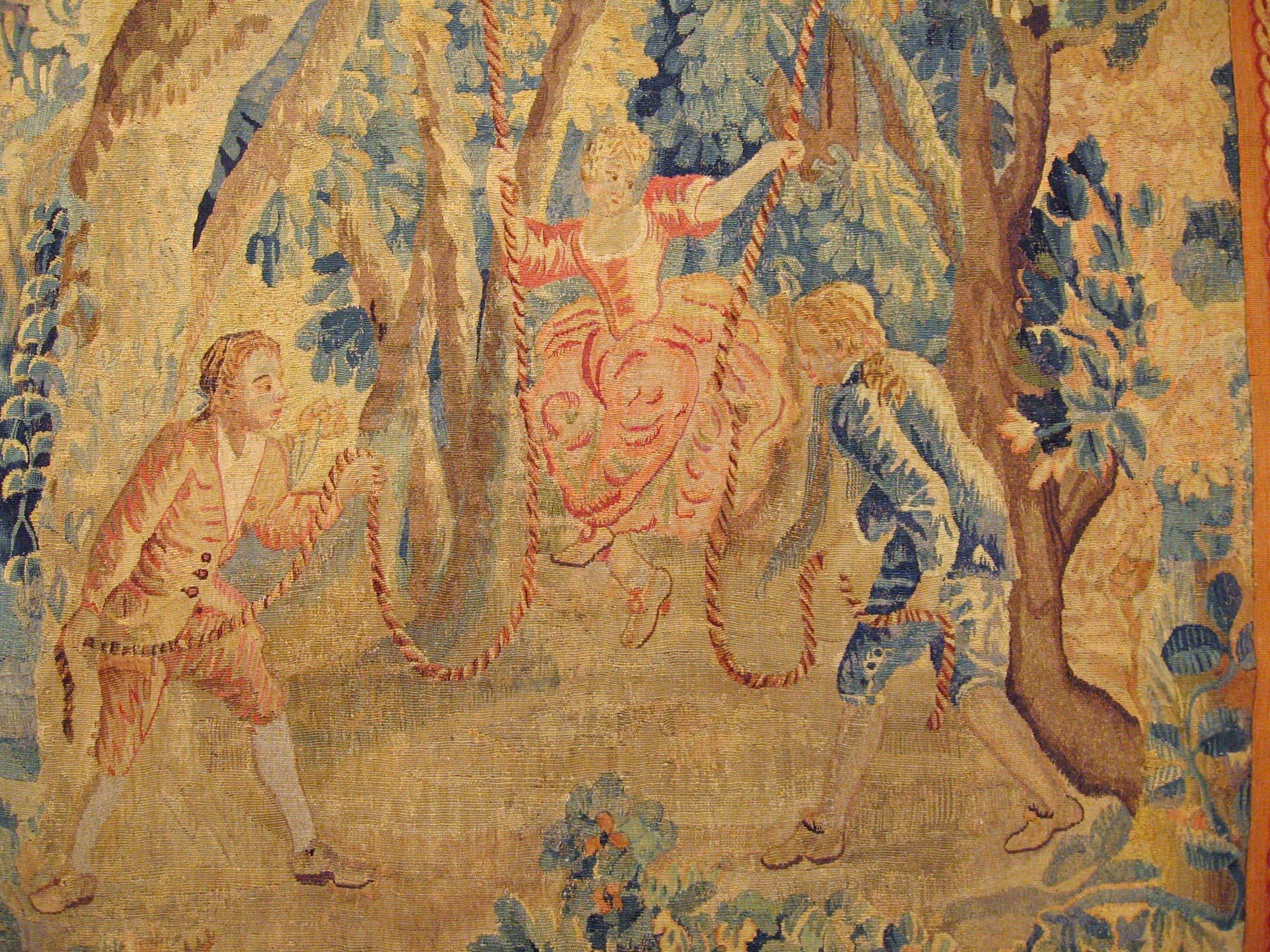 European 18th Cent., Flemish Rustic Tapestry, with Young Men and Women Playing on a Swing For Sale