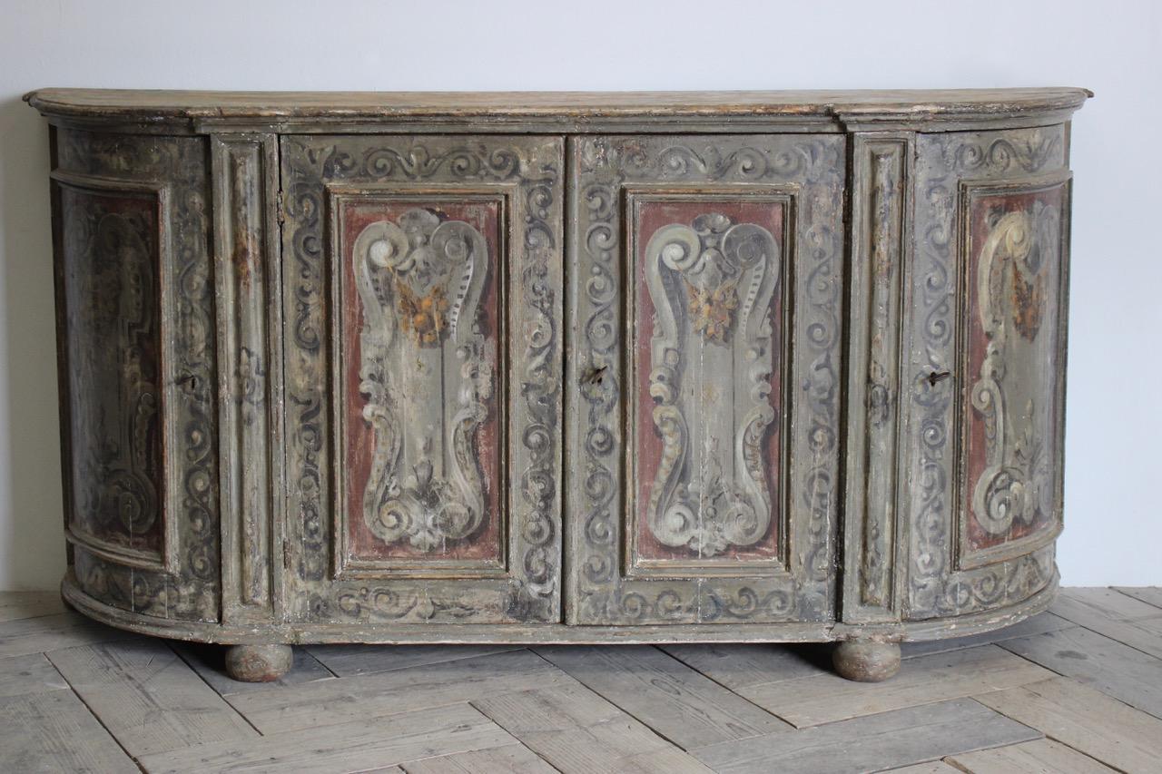 A very elegant and offering plenty of storage, 18th century Italian painted enfilade, retaining most of the original paint, with some retouches. 
Italy, circa 1800.
 