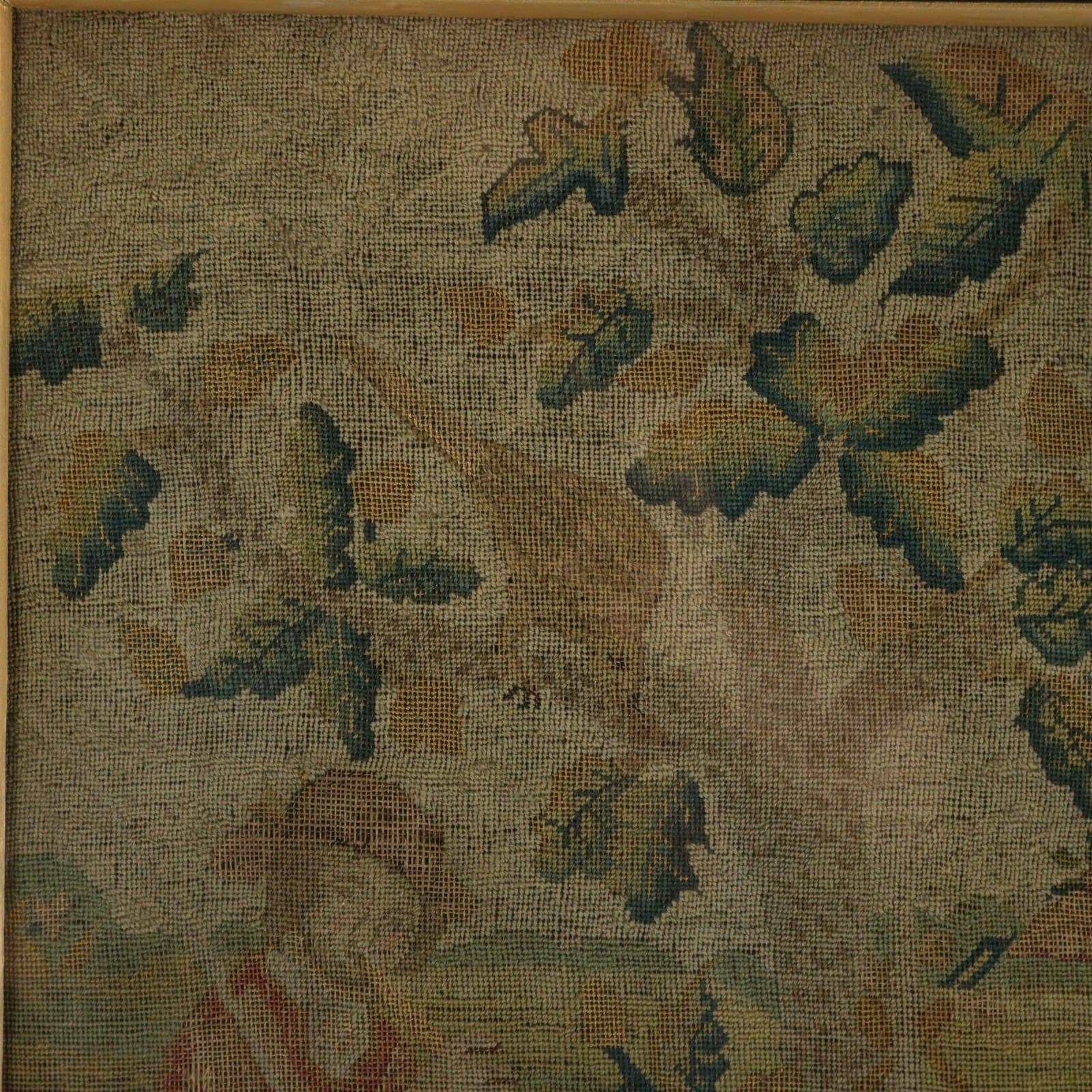 An 18th Century petit point silkwork embroidery of a lady and gentleman stood in a country cottage garden. Sheep and a dog in the foreground. A house with a fence in the background. And a leafy tree with birds perched in it. Dated, '1732' to the