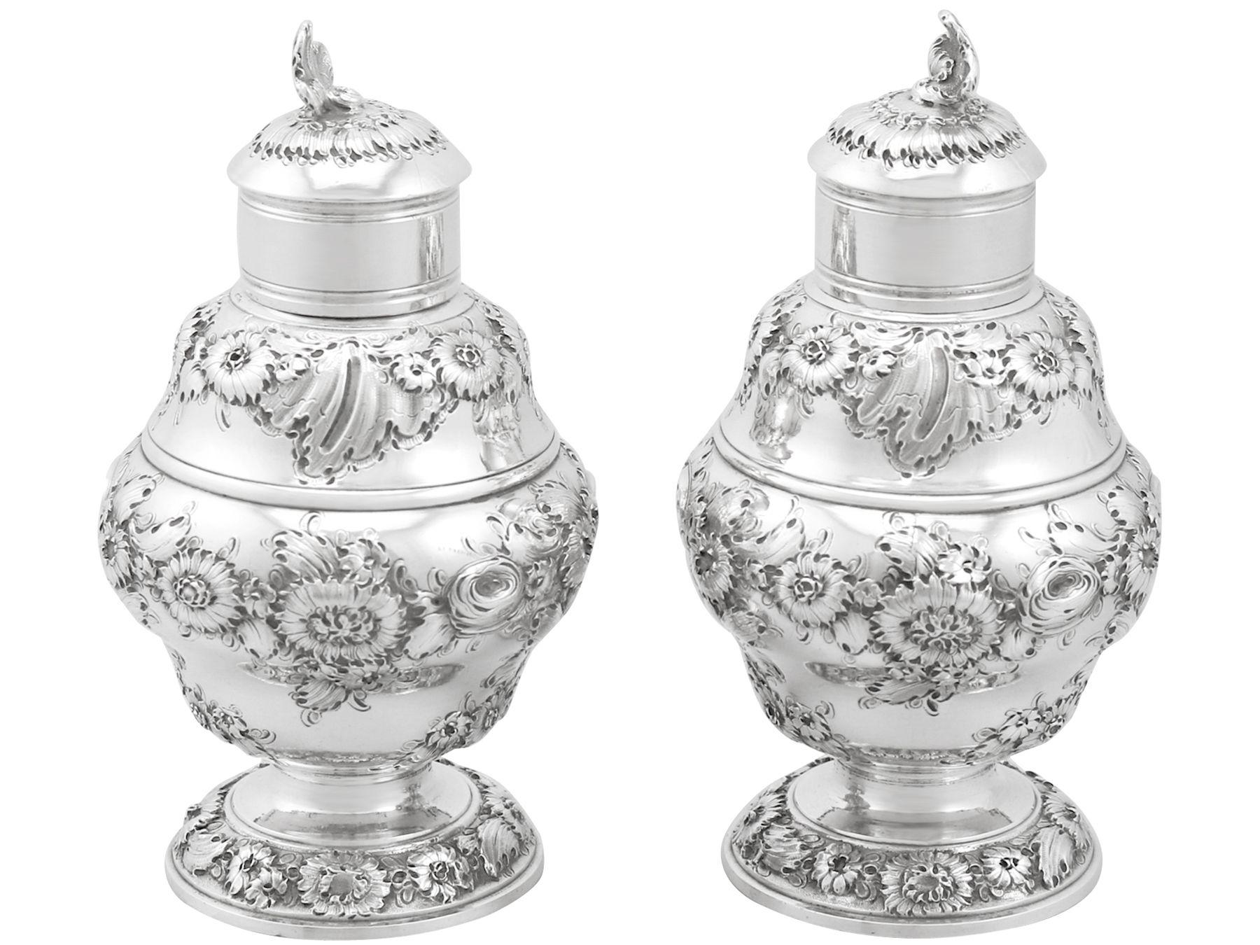 An exceptional, fine and impressive pair of antique Georgian English sterling silver tea caddies; an addition to our silver teaware collection.

These exceptional antique George II sterling silver tea caddies have a circular baluster shaped