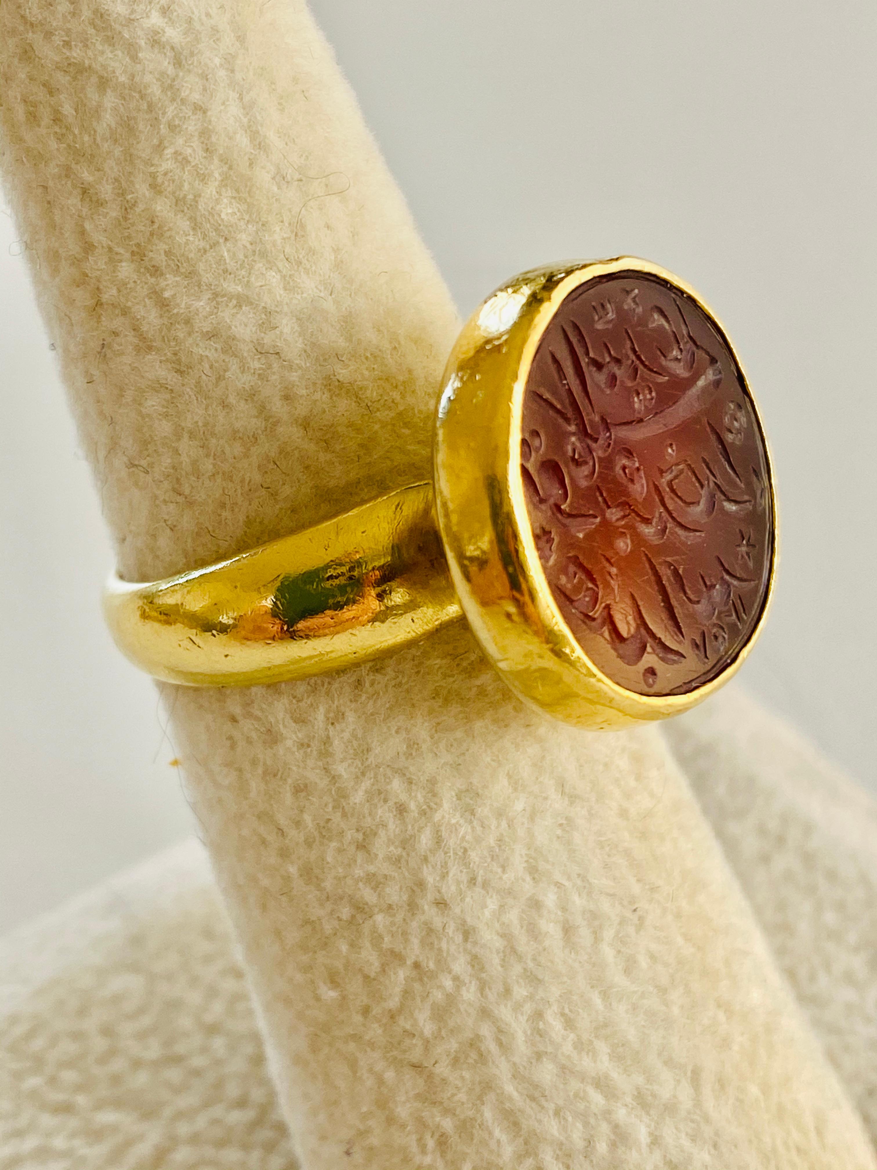 This intaglio-cut carnelian Arabic seal is from the 18th Century and was set in an 18k custom made casting in the early 2000's.

Stone: Carnelian, Chalcedony.
Stone Size With Bezel Setting: Approximately 11/16