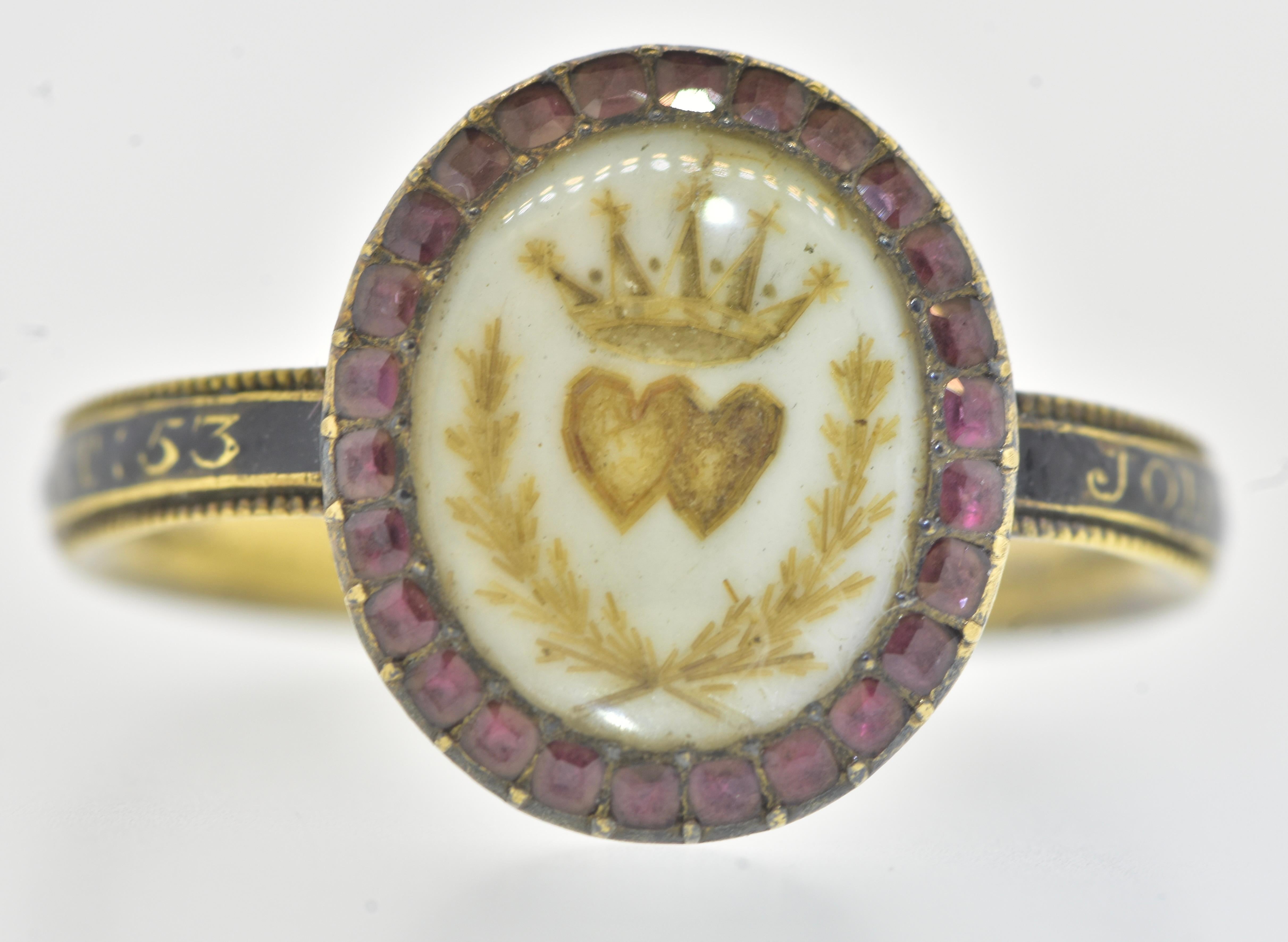 Antique Eighteenth Century 18K yellow gold ring decorated, under rock crystal, with two joined hearts under a crown and above crossed sprays of wheat on a white background. This was done in rudimentary or handmade fashion and painted with a handmade