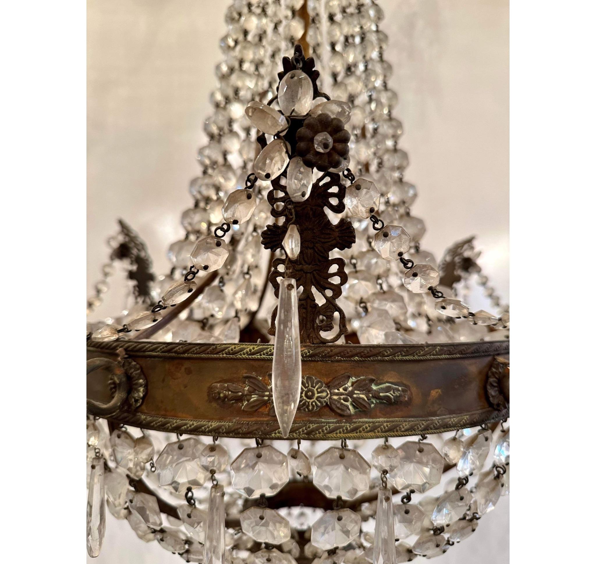 This chandelier has the original patina from years past. It was originally candle and would make a gorgeous entry fixture or dinning room 