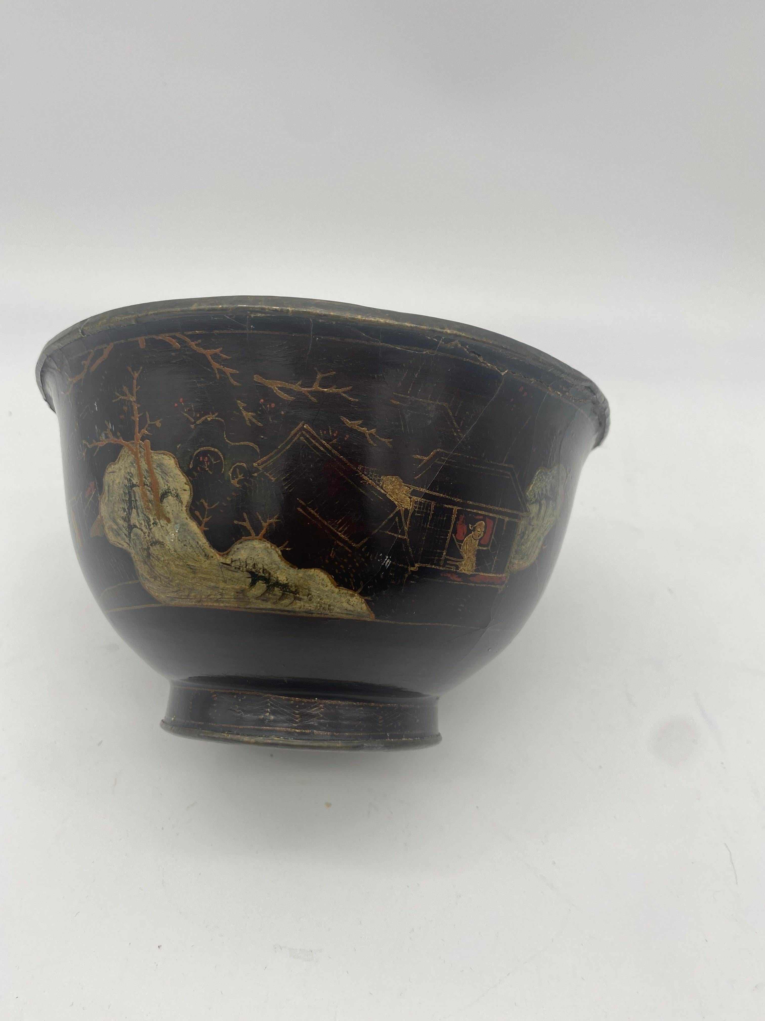 Chinese lacquer bowl of deep flared form with pewter from the 18th century. Over a body of black lacquered the exterior decorated with gilt scenes of figures within a landscape, with lined interior and incised with mark to base dimension 6.5 inch x