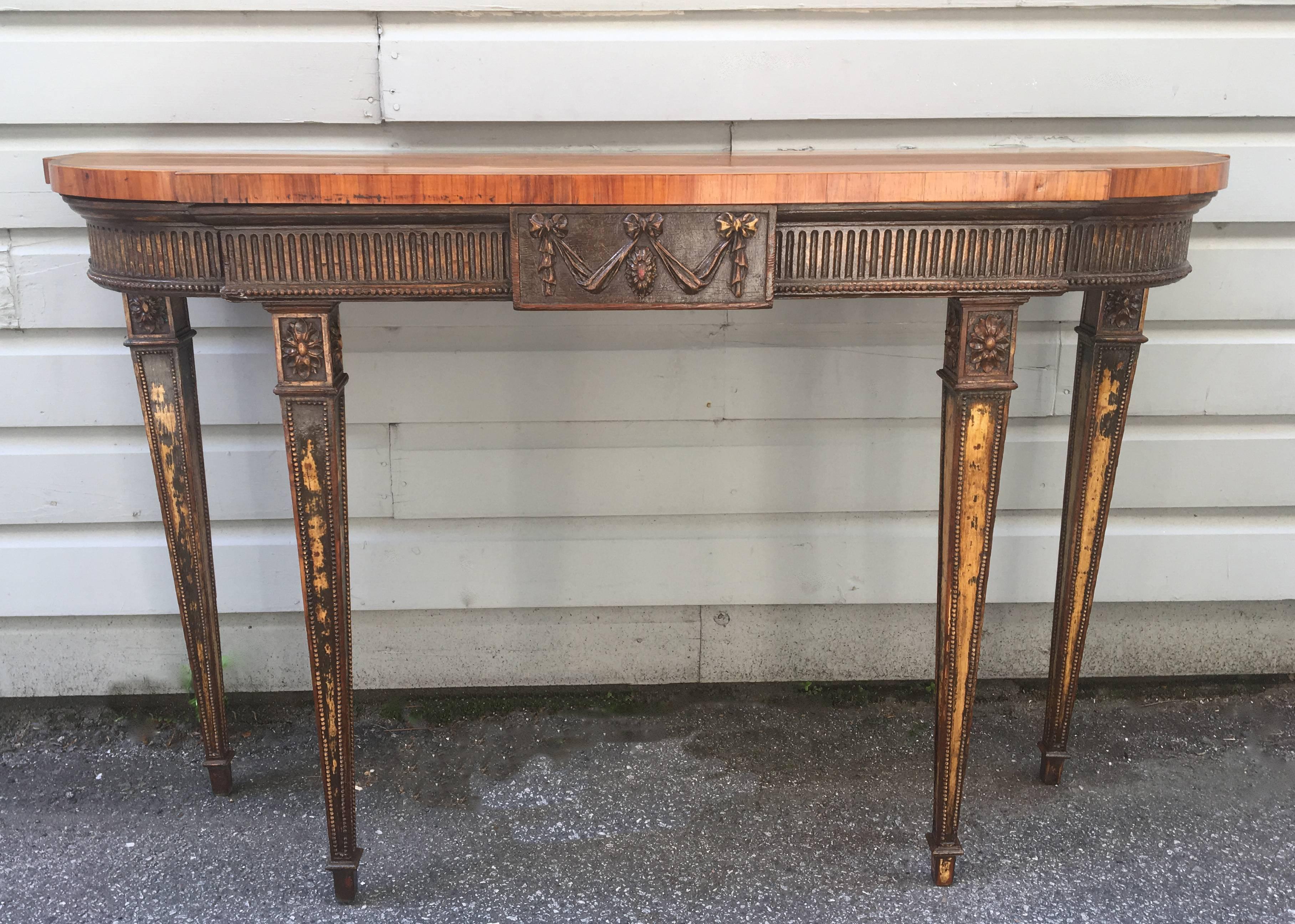 18th century Adams console table with distressed base and satinwood top. All carved wood with some original paint still showing.