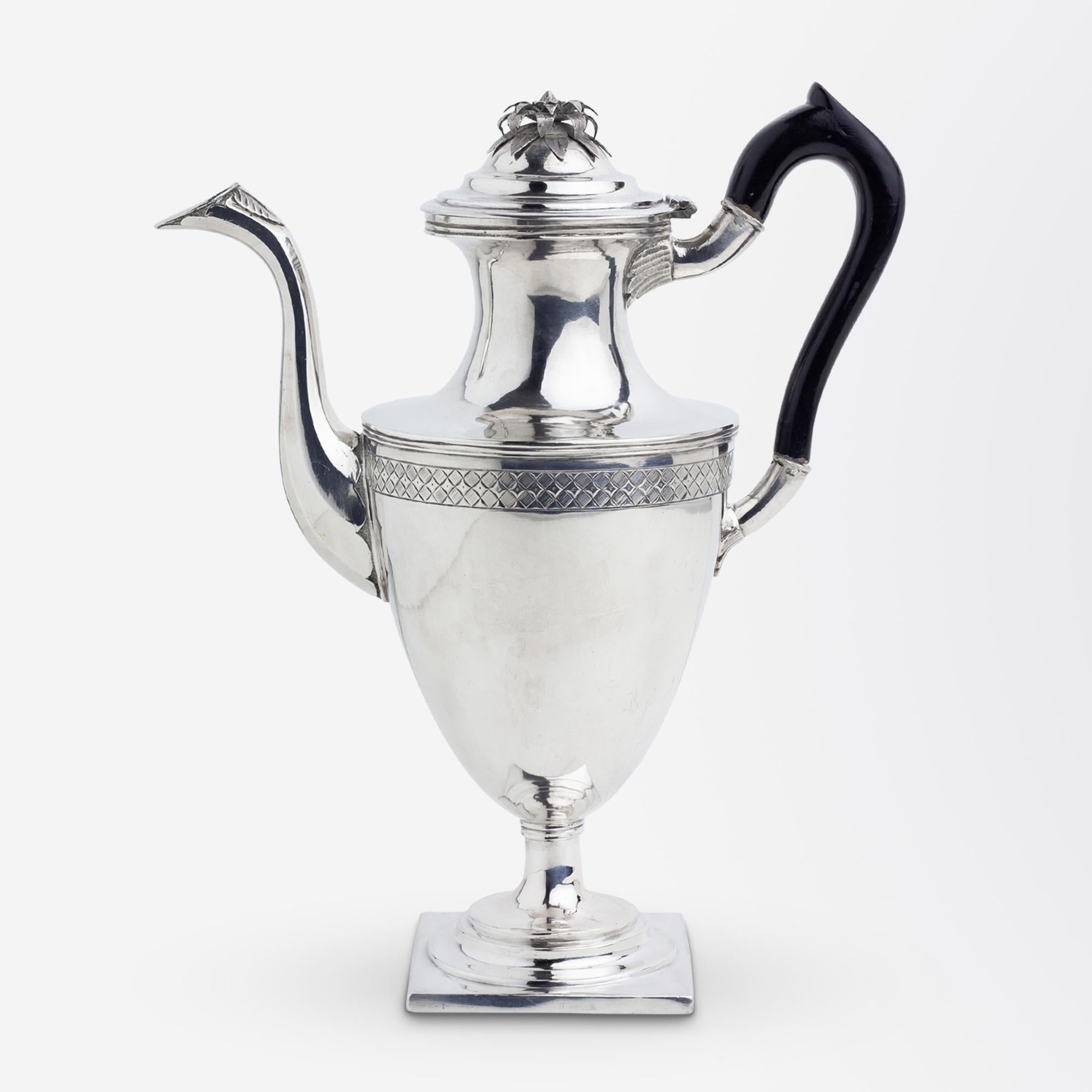 This rather elegant coffee pot was likely made in the United States during the second half of the 18th Century. Prior to restoration work in 2022 the underside of the pot had remnants of a hallmark 'NH', allowing us to attribute the piece to early