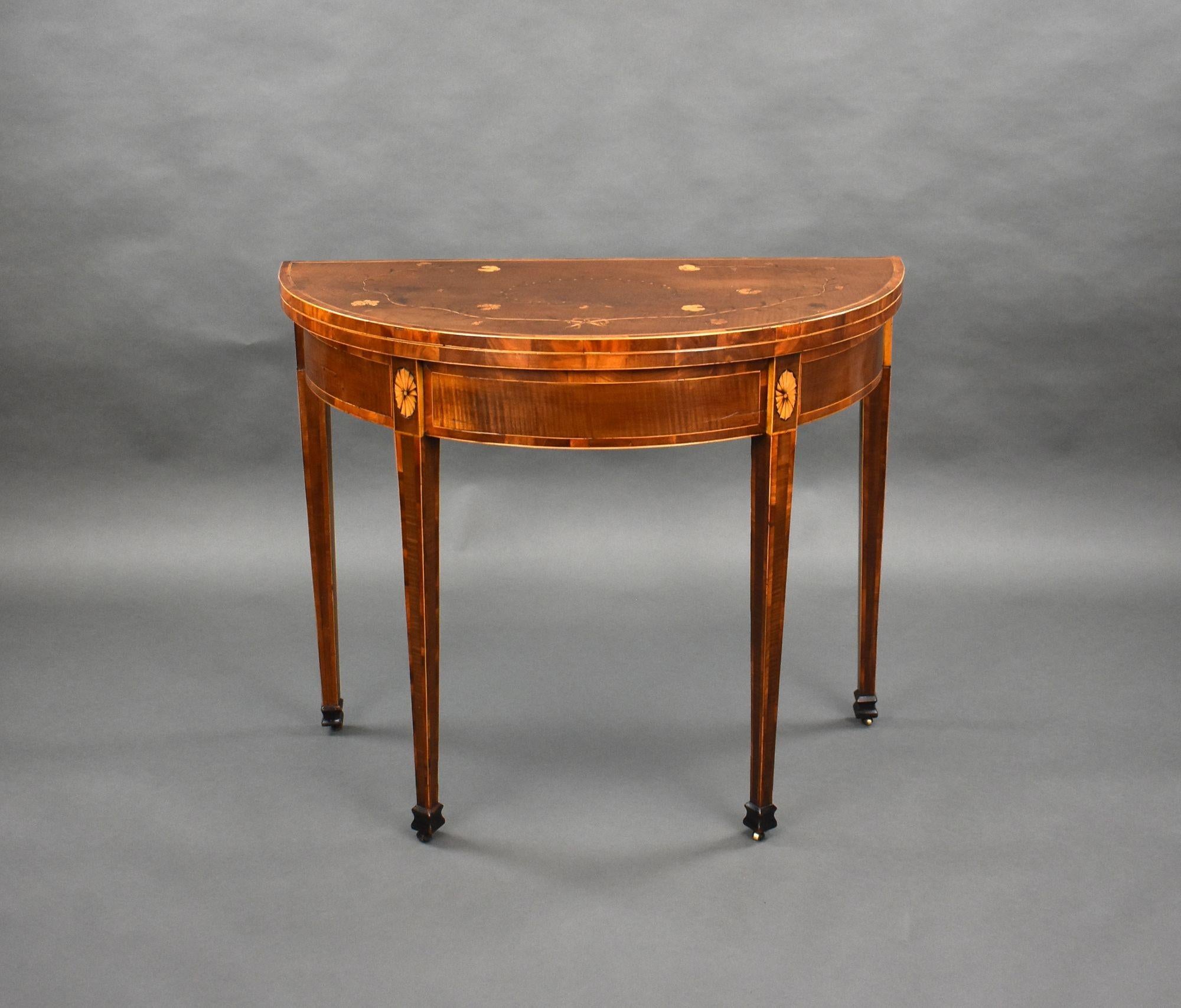 For sale is a good quality 18th century American federal mahogany inlaid card table, the half round top intricately inlaid, supported by a gateleg to the rear, opening to a baise lined interior. The table stands on elegant tapered legs terminating