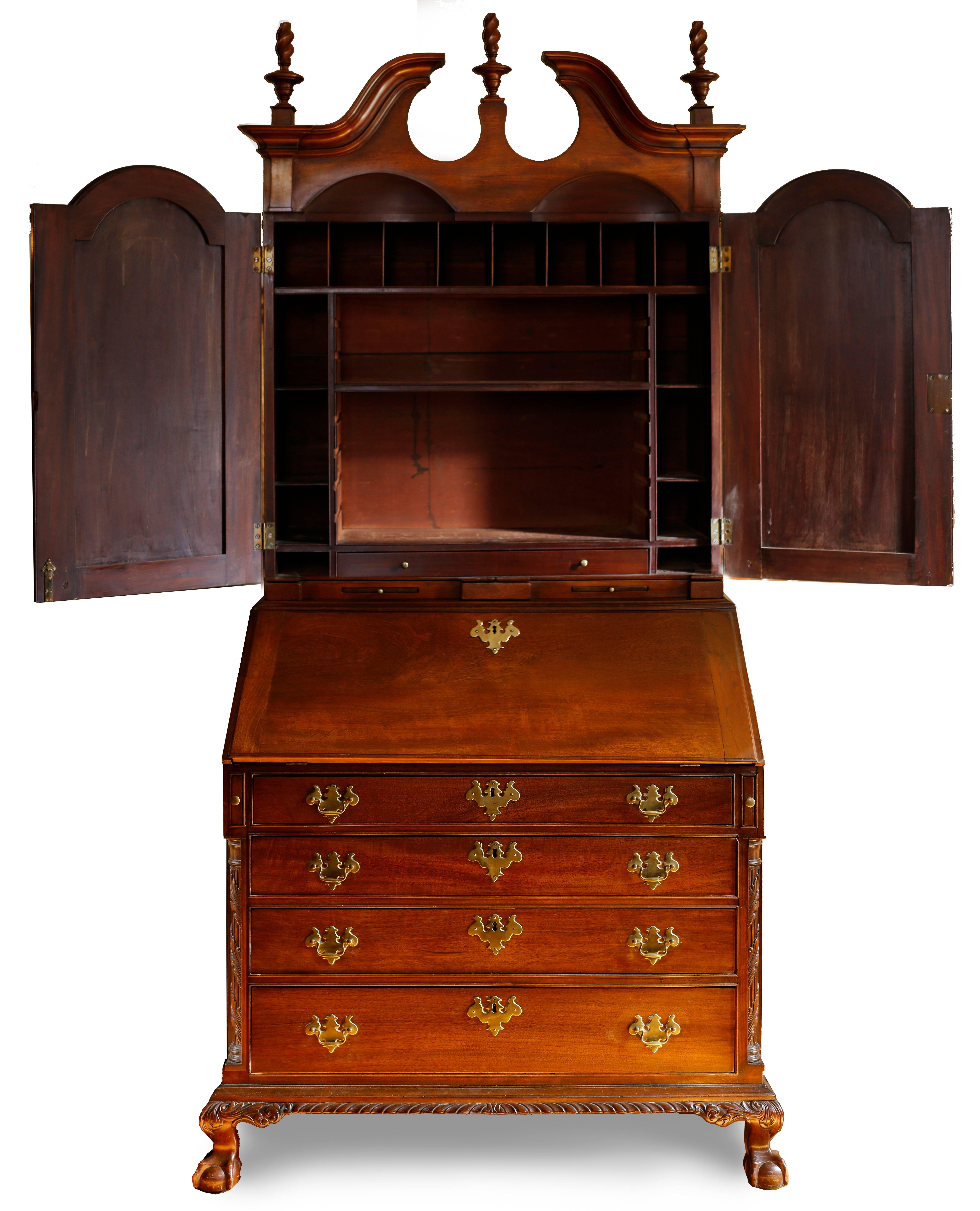 A stunning piece of early American furniture with excellent provenance, this secretary bookcase was designed and constructed by one of the best firms in 18th century Boston with is fine classical forms and proportions. Corkscrew finials, fluted