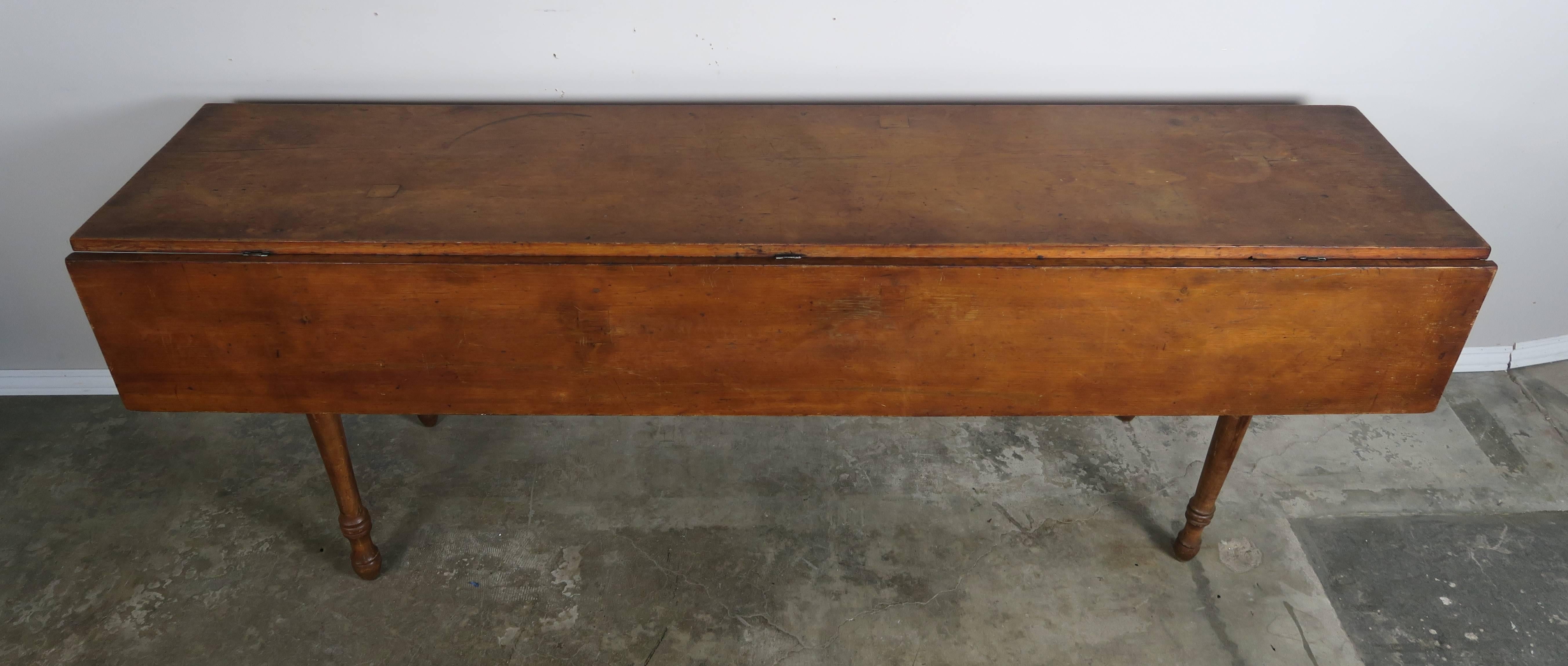 18th century primitive American drop-leaf table. Size of table with dropped leaves-84