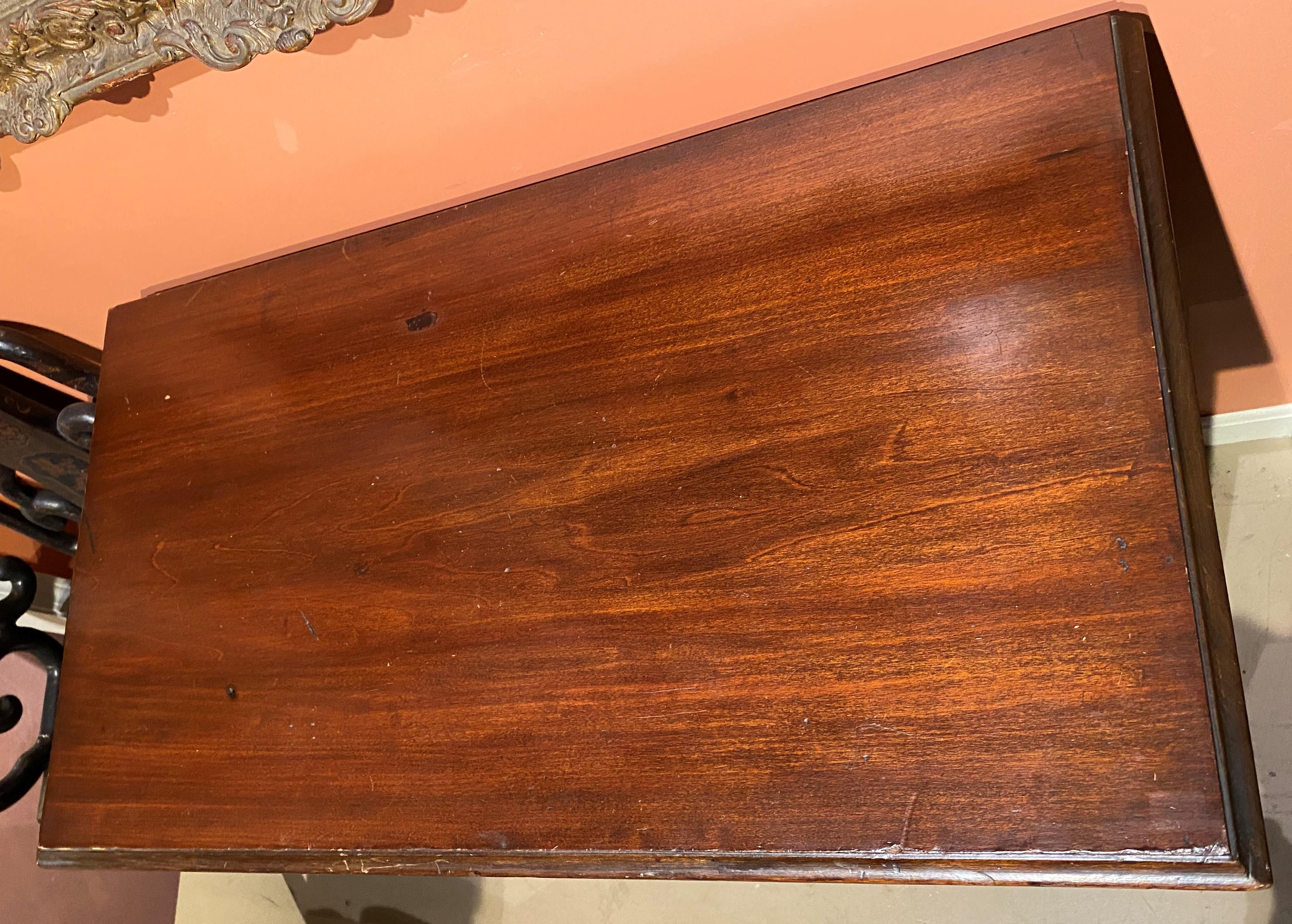 A fine example of an 18th American chest of drawers in a two over three configuration, possibly a converted highboy top of Boston origin, with added finished molded top, original brasses, including side brass handles, cross banded drawer fronts, and