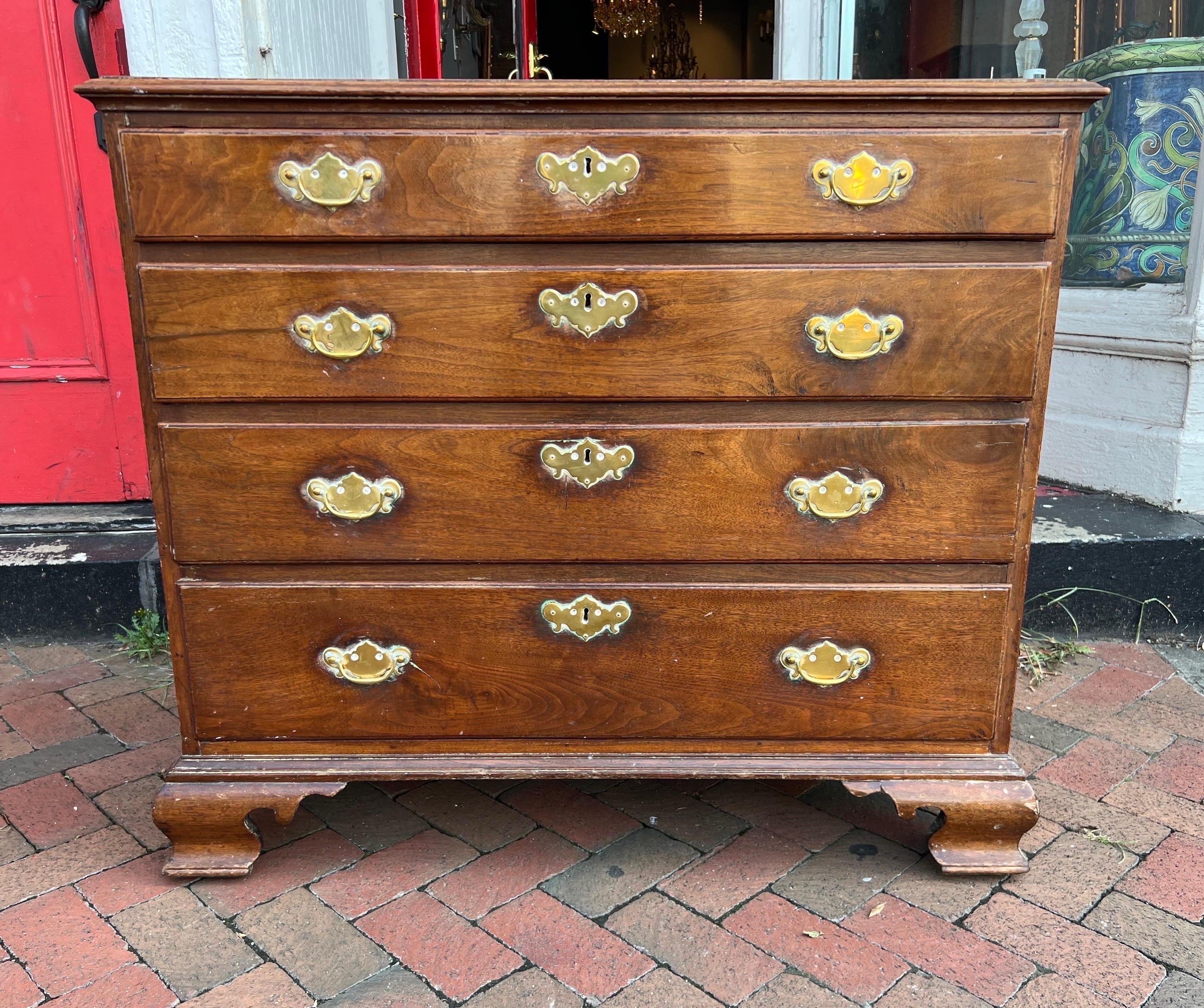 Great American walnut chest on ogee bracket feet with graduated drawers and molded top with a nice warm mellow color and height good for a bedside chest. Probably from Virginia or Pennsylvania.