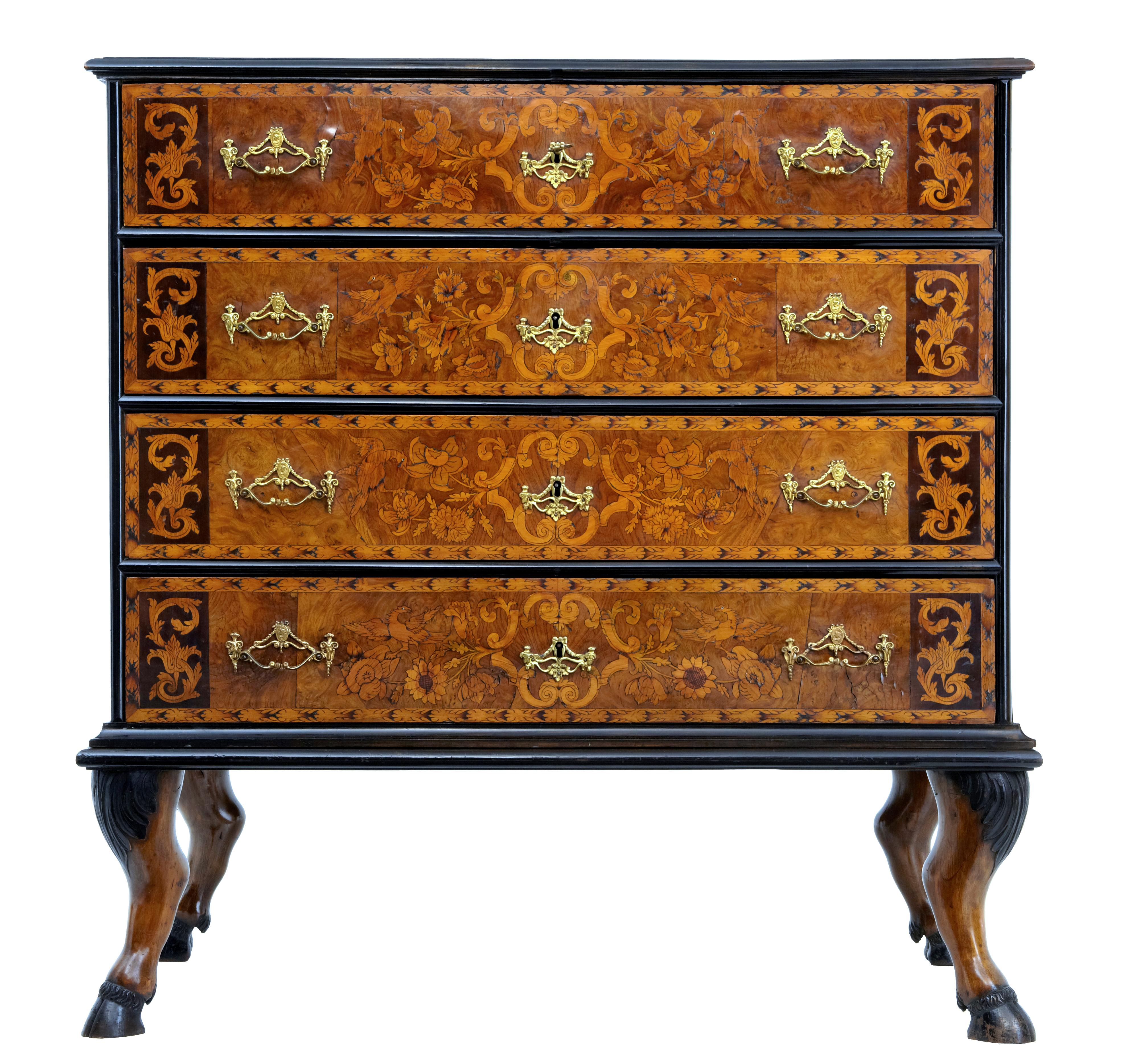 18th century and later continental marquetry chest on stand circa 1740.

Stunning 18th century chest circa 1740 on a 19th century stand. 

Beautifully example of floral marquetry inlaid with walnut, ebony, boxwood and elm. Profusely inlaid