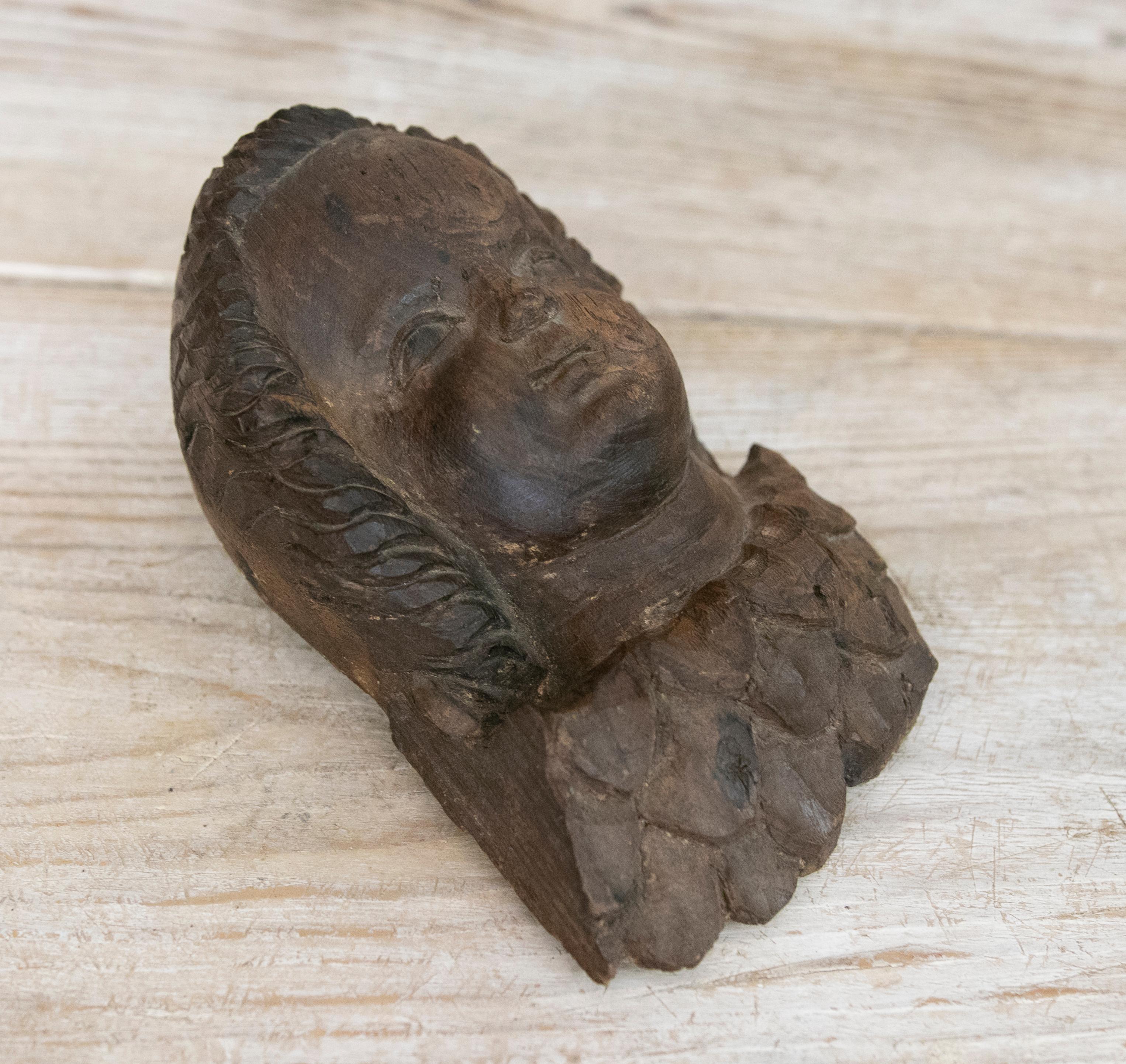 18th century Angel's head sculpture handcarved in wood.