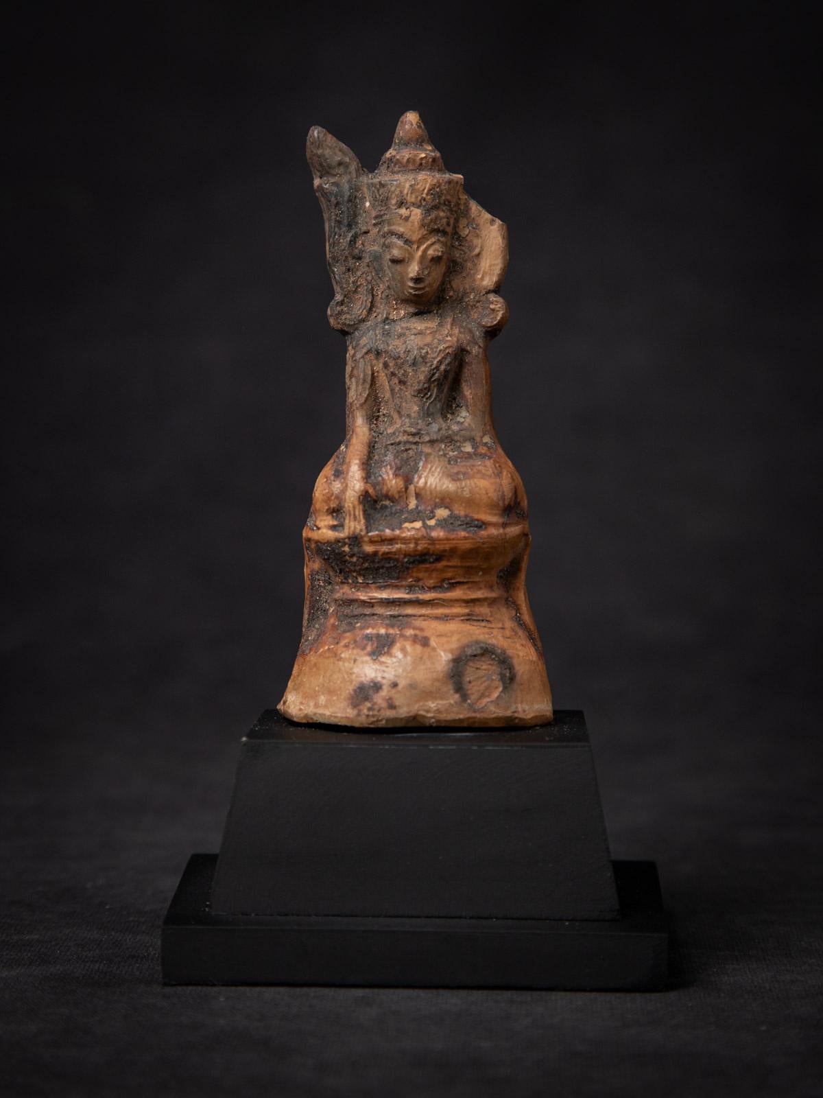 Antique Burmese Buddha amulet

Material: Pottery
15,6 cm high
9 cm wide and 7,2 cm deep
Shan (Tai Yai) style
Bhumisparsha mudra
18th century
Weight: 227 grams
Originating from Burma (Myanmar)