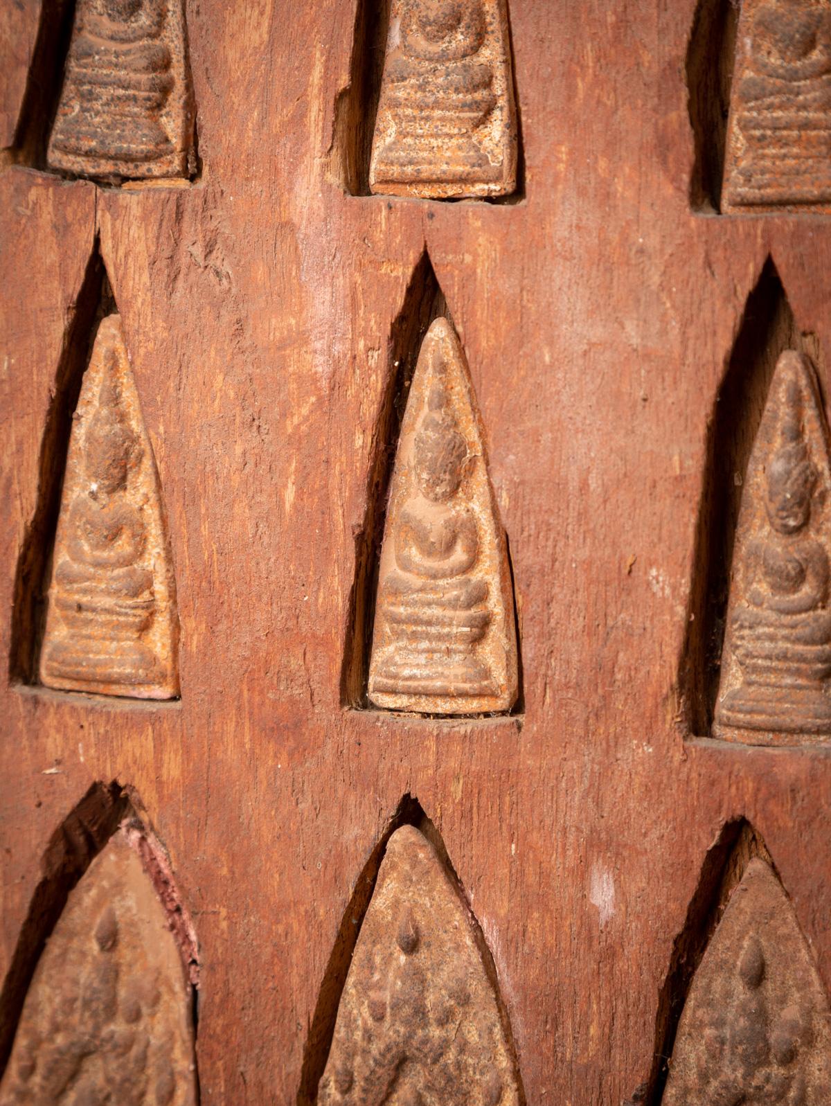 18th century antique Burmese wooden panel with 16 terracotta Buddha amulets 10