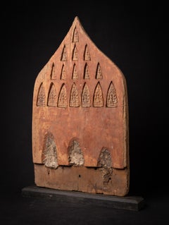 18th century antique Burmese wooden panel with 16 terracotta Buddha amulets