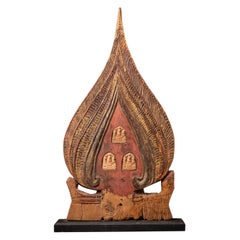 18th century antique Burmese wooden panel with three terracotta Buddha amulets