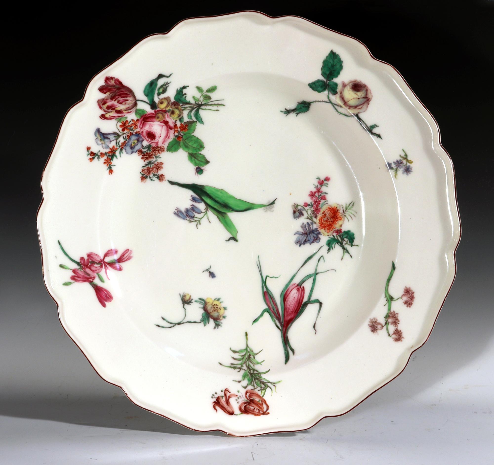 18th-century Chelsea Porcelain Large Botanical Dish,
Red Anchor Period,
Circa 1755.

The unusually large Chelsea porcelain dish, with a petal-shaped rim is decorated with scattered bouquets and flowers including roses and tulips. The painting is