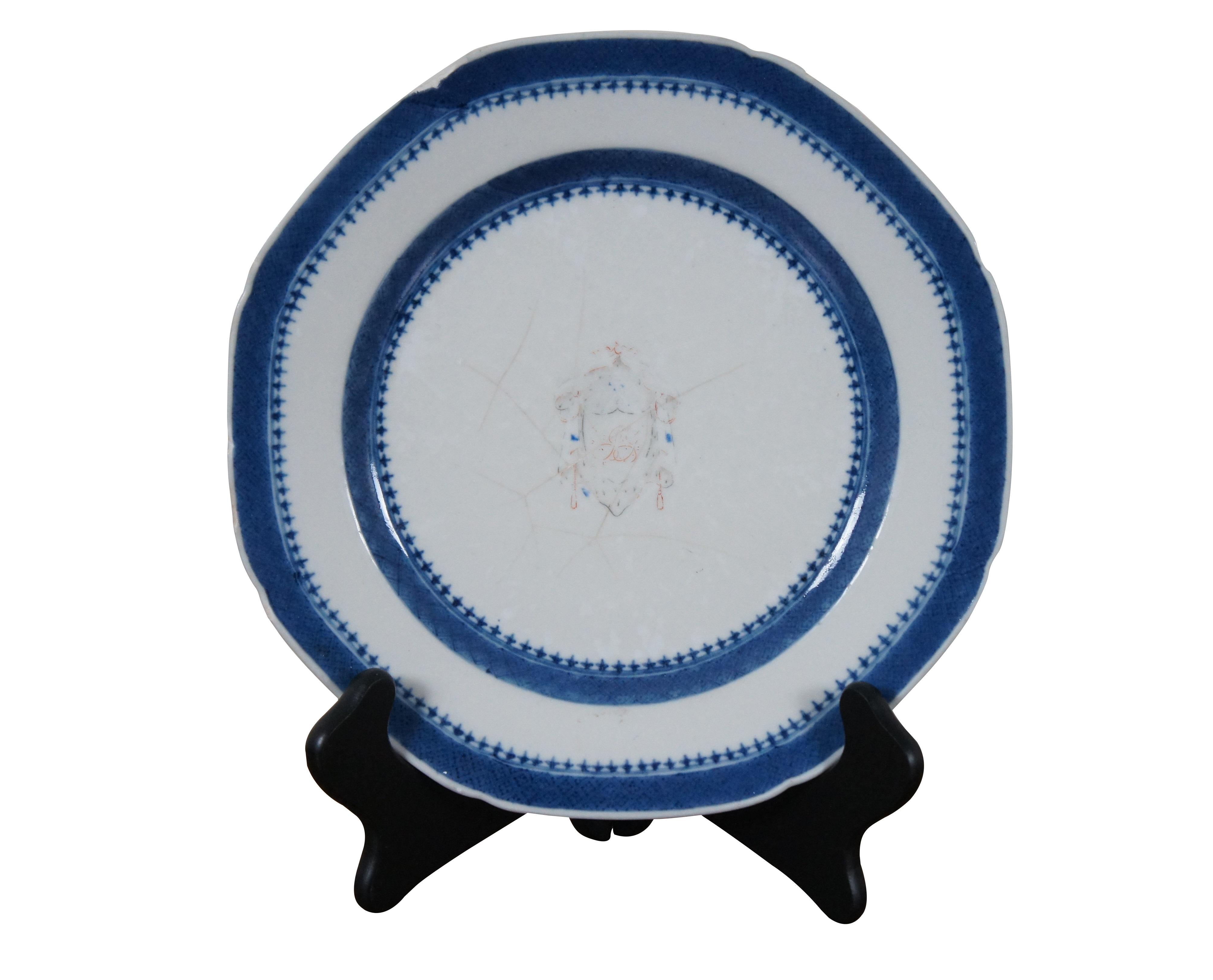 Pair of 18th century Chinese Export porcelain plates featuring slightly scalloped edges, hand painted blue and white borders and armorial crest / coat of arms at the center. Includes two folding stands for display.

Dimensions:
9.5