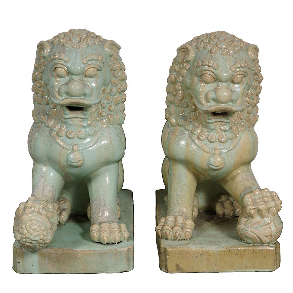 This pair of magnificent Chinese antique Porcelain lions/foo dogs statuary are hand made and hand carved porcelain. According to historical books, lions were introduced into Mainland China firstly as tributes to the Emperors. They are symbols of