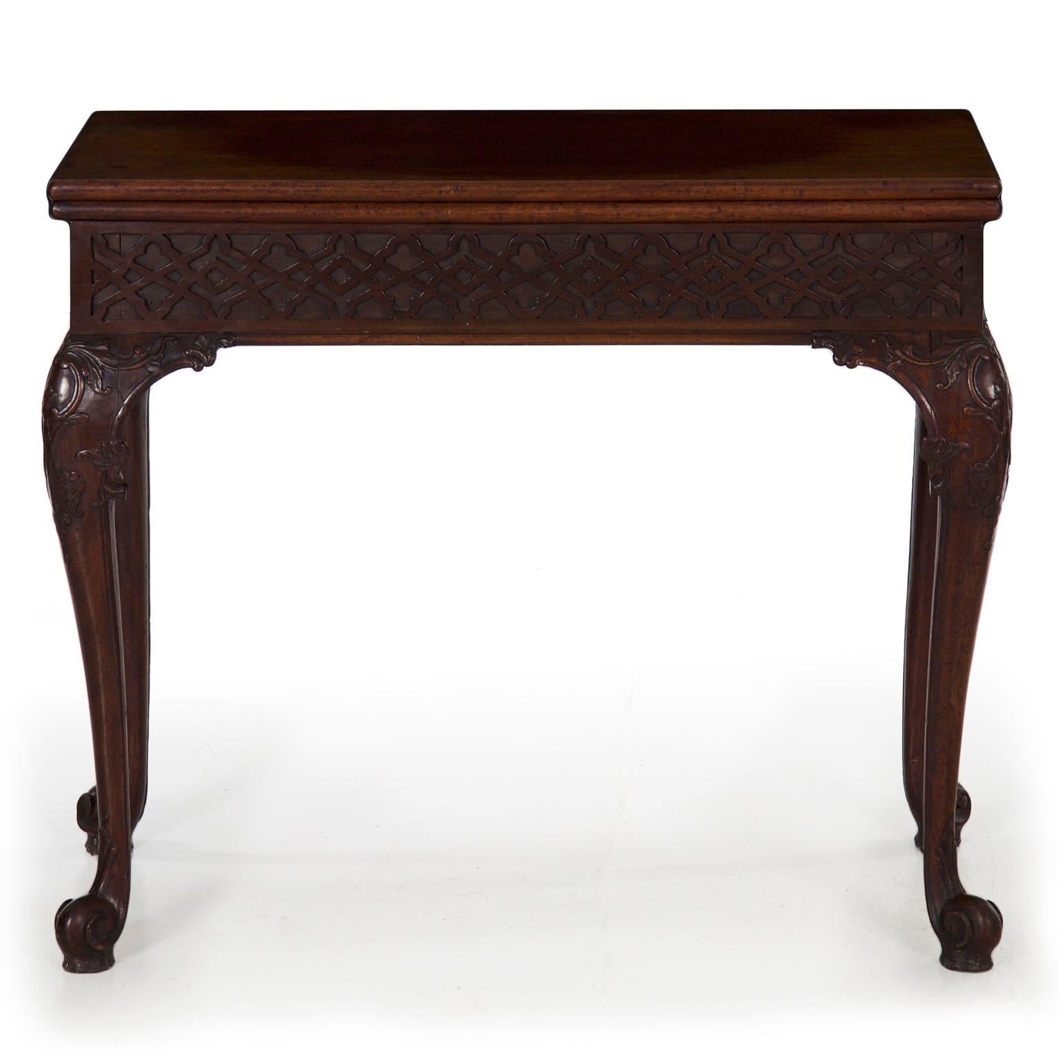 CHIPPENDALE CARVED MAHOGANY CARD TABLE WITH PIERCED FRETWORK APRON
England, circa 1770
Item # 810FPP06S

Characterized by the French-inspired cabriolet legs, this rare card table is a simple exquisite example of the wealth of perspective that was