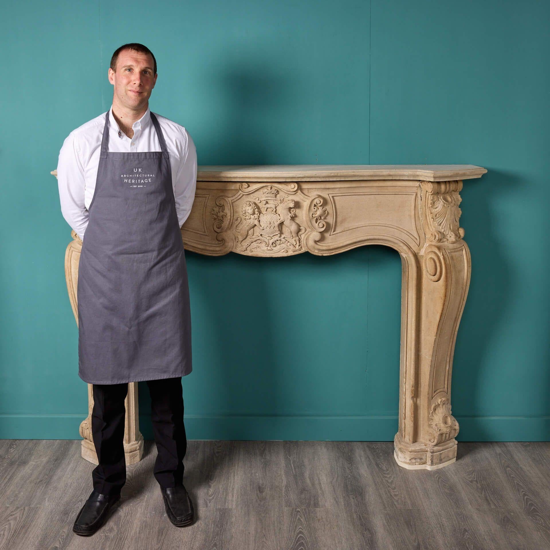 This spectacular antique limestone fire mantel is an extremely rare and unique find, steeped in centuries old English history. It once resided at Warter Priory in Pocklington, Yorkshire UK and is exquisitely hand carved in the French style with the
