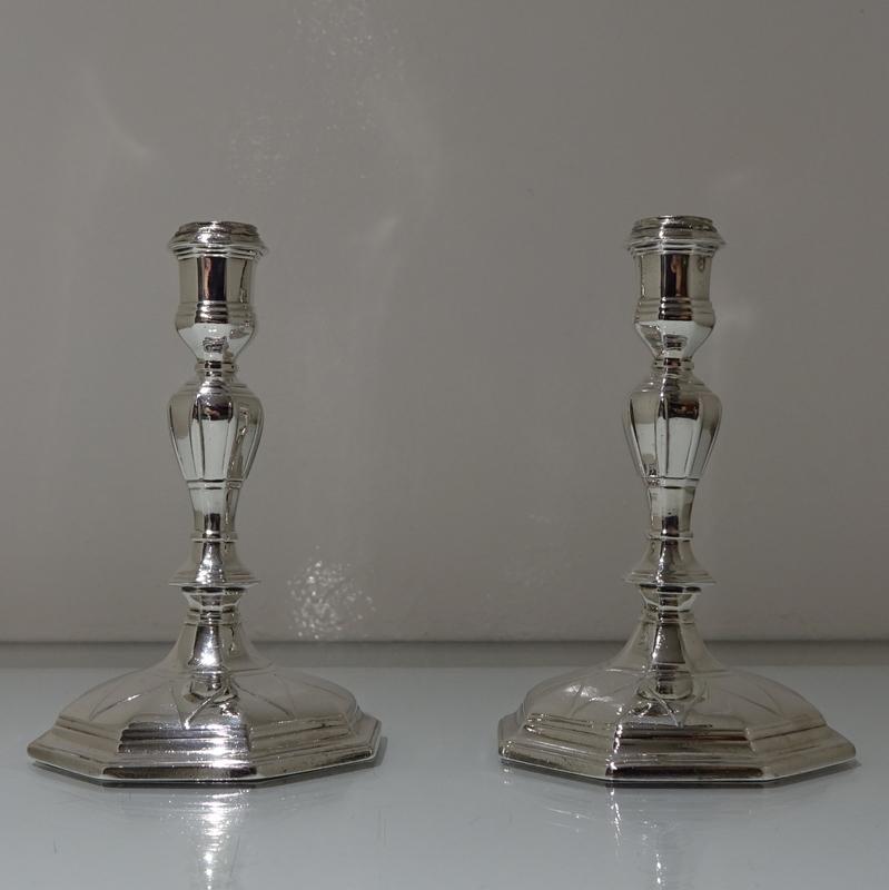 An incredibly rare pair of early 18th century cast octagonal candlesticks. The bases have a stunning design of “drooping leaf” workmanship for low lights and the octagonal tapering stems have elegant “ribbing” around the central columns.

