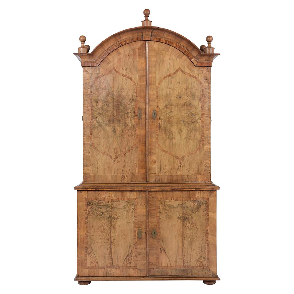 This extraordinary English 18th century George II style linen cabinet is crafted out solid walnut covered with a beautiful marquetry design and has been newly restored. This remarkable cabinet is finished in a light walnut color waxed and polished