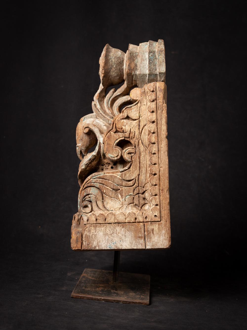 This Antique Indian wooden temple fragment holds a captivating history within its design. Crafted from wood, it stands at a height of 43.3 cm with dimensions of 20.5 cm in width and 16.5 cm in depth. Dating back to the 18th century, this temple