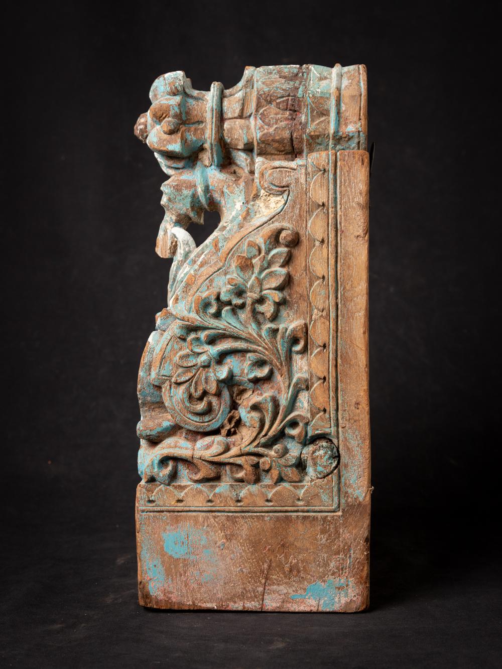 This Antique Indian wooden temple fragment holds a captivating history within its design. Crafted from wood, it stands at a height of 39,6 cm with dimensions of 19,6 cm in width and 16,6 cm in depth. Dating back to the 18th century, this temple