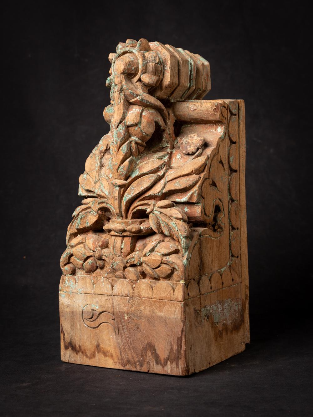 This Antique Indian wooden temple fragment holds a captivating history within its design. Crafted from wood, it stands at a height of 34,8 cm with dimensions of 16 cm in width and 14,3cm in depth. Dating back to the 18th century, this temple