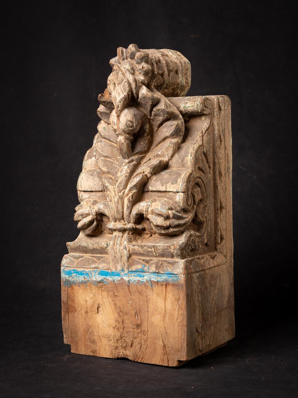 This Antique Indian wooden temple fragment holds a captivating history within its design. Crafted from wood, it stands at a height of 39,8 cm with dimensions of 18,1 cm in width and 13,7 cm in depth. Dating back to the 18th century, this temple