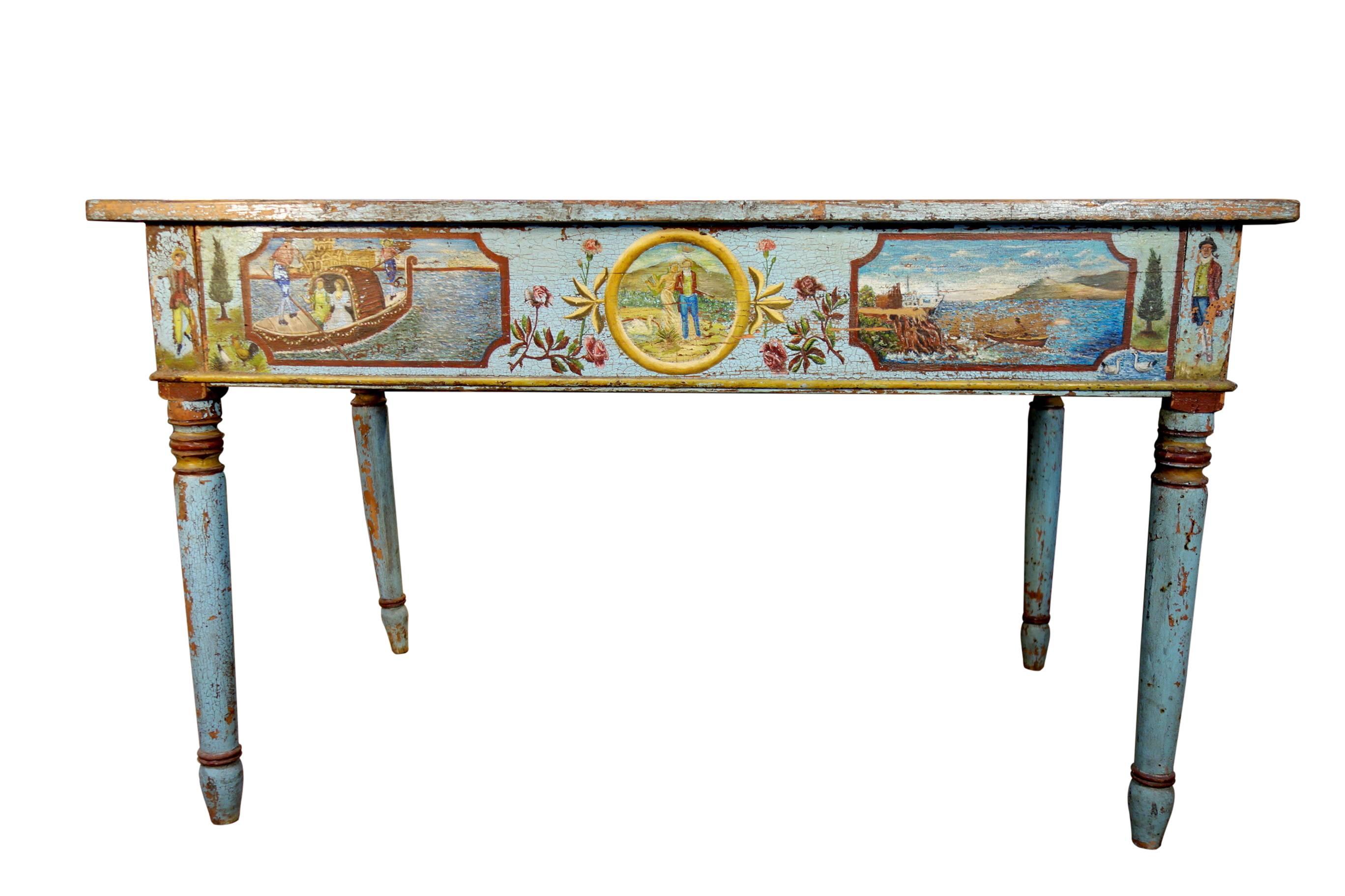 Charming well-preserved Sicilian two-drawer writing desk featuring lovely honeymoon scenes hand-painted on front and sides and fruits on the drawer side. 
Measures: 51.5