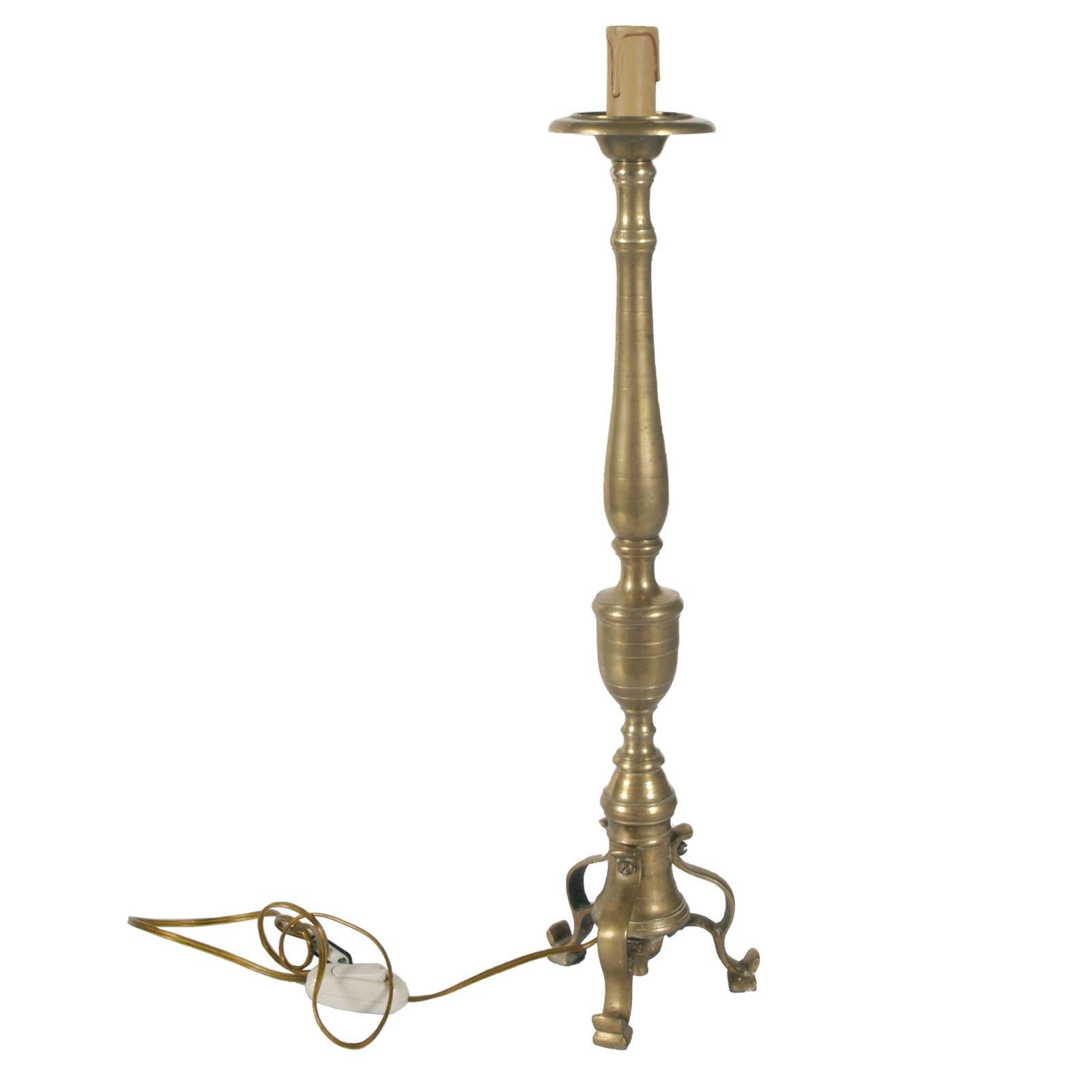 Heavy and massive original 18th century antique lampholder candelabrum in gilt brass with tripod stand

Measures cm: height 57, diameter 13.