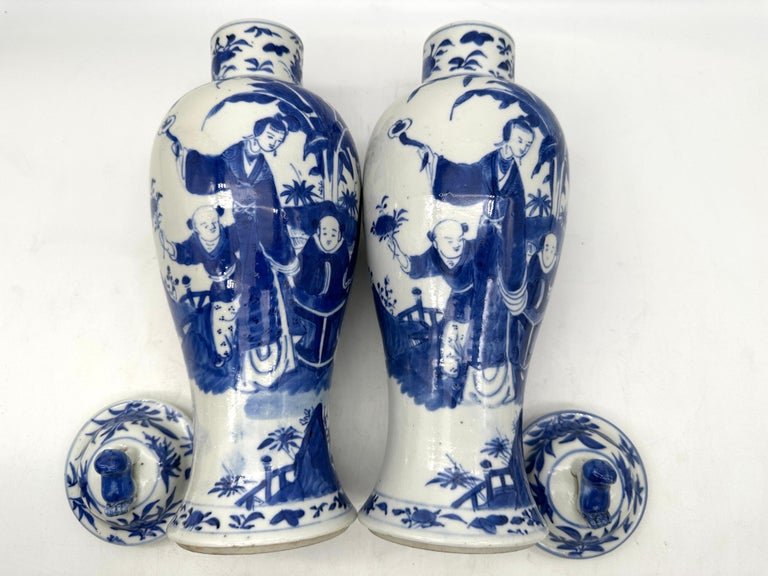 Carved 18th Century Antique Pair of Chinese Blue and White Porcelain Jars and Covers For Sale