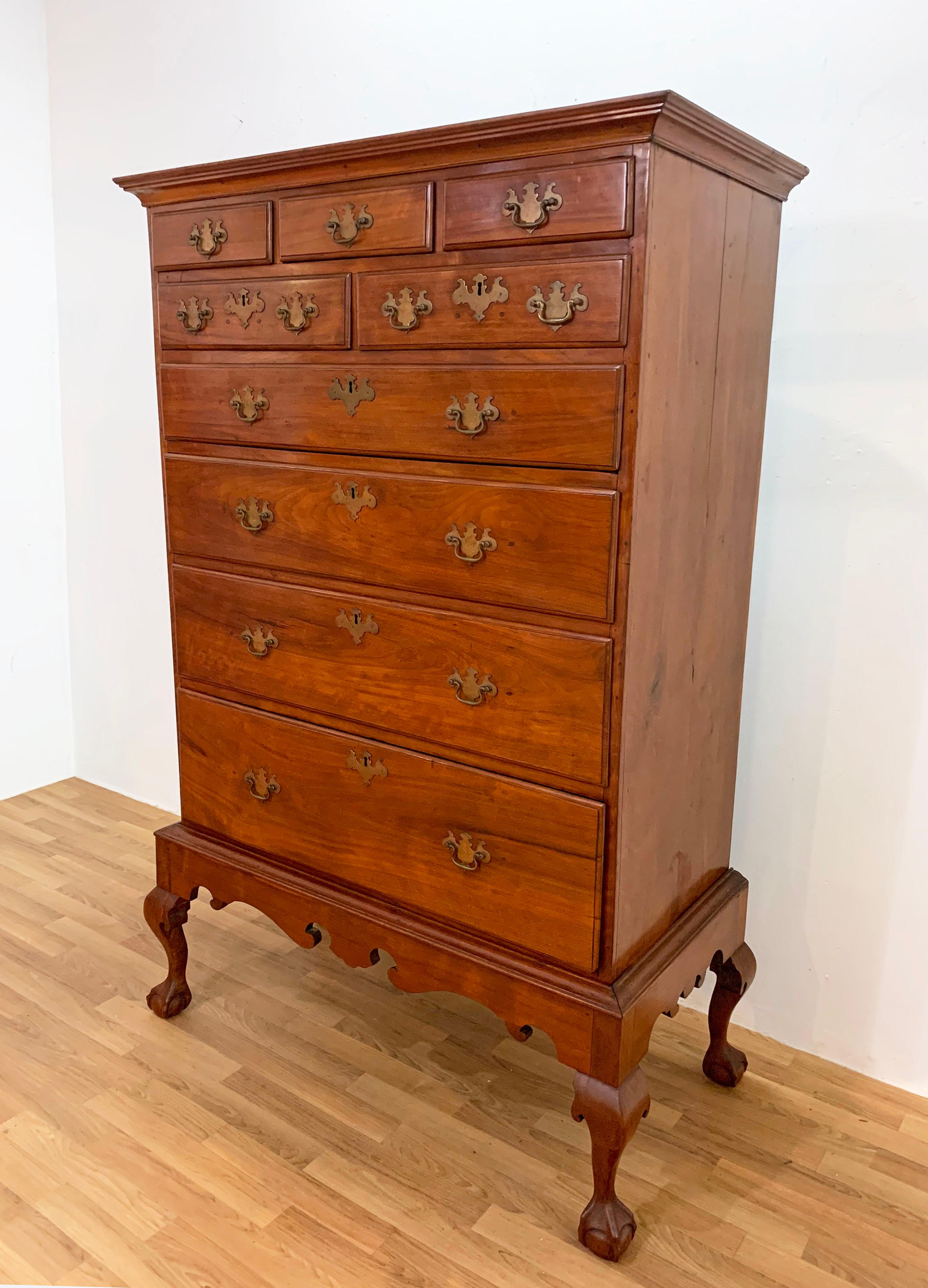 A Queen Anne style flat top chest in cherry of three drawers over two atop four graduated drawers, circa 1760s. Carved apron above spurred cabriole legs. Most likely Western Massachusetts or Eastern New York origin.