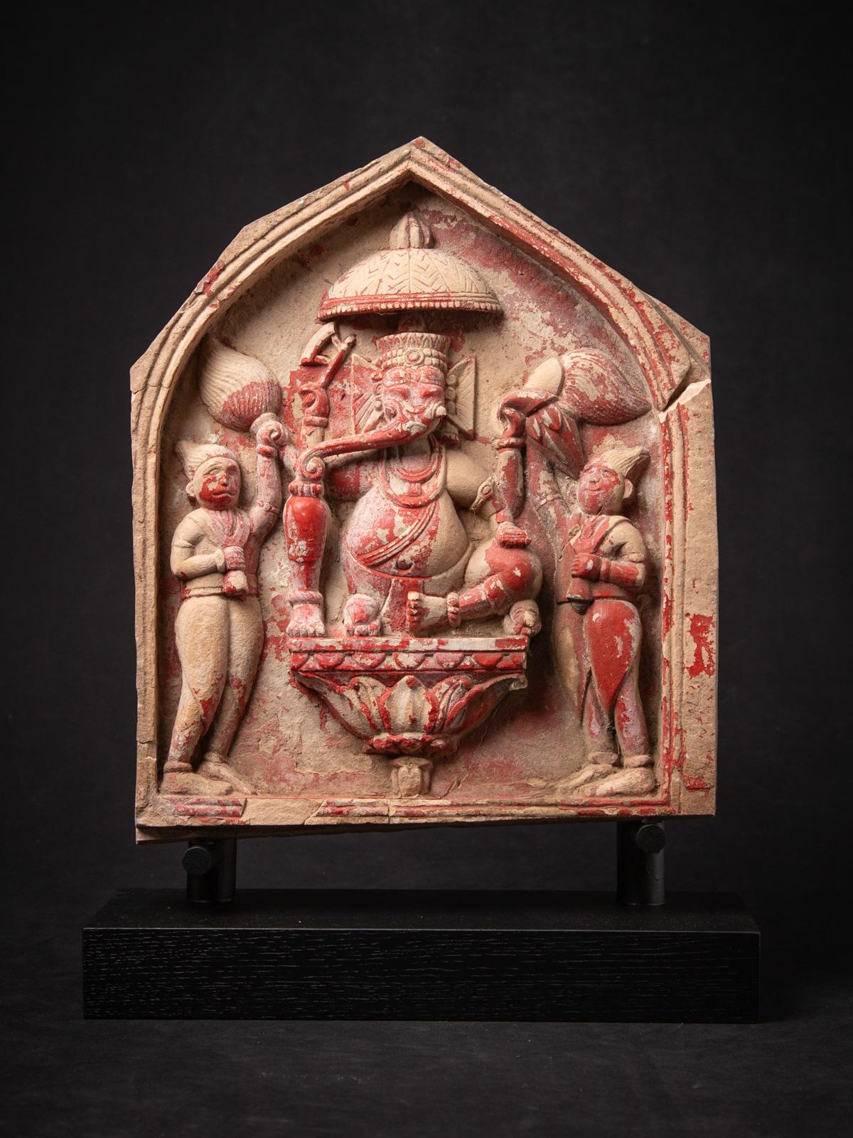 This antique sandstone Ganesha statue is a magnificent and rare piece of 18th-century Indian art, showcasing the revered Hindu deity in a detailed and spiritually rich composition. Expertly carved from sandstone, the sculpture measures 49 cm high,