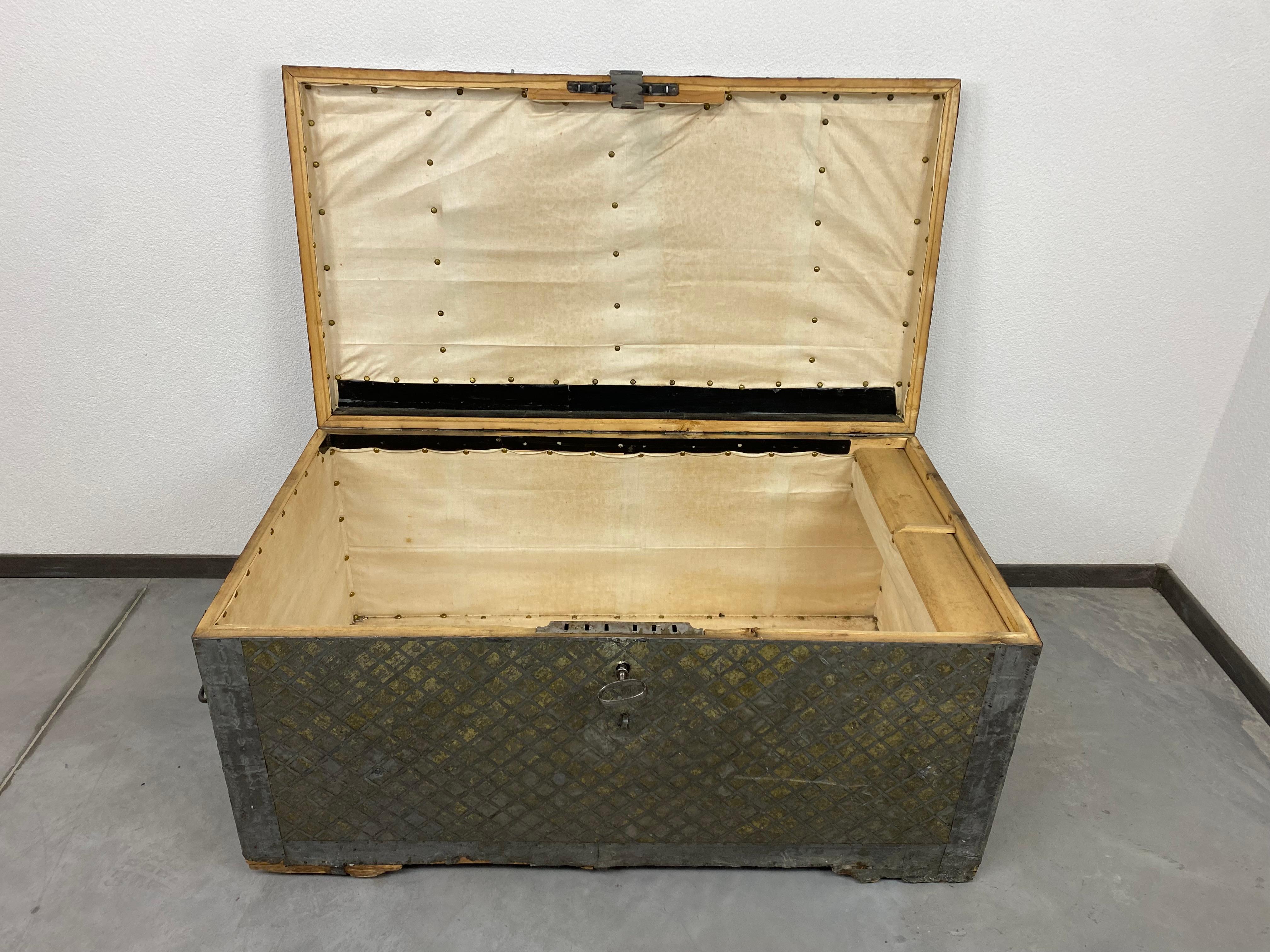 18th century antique travel chest. Solid wood with tin cladding. Baroque lock fully functional with original key.