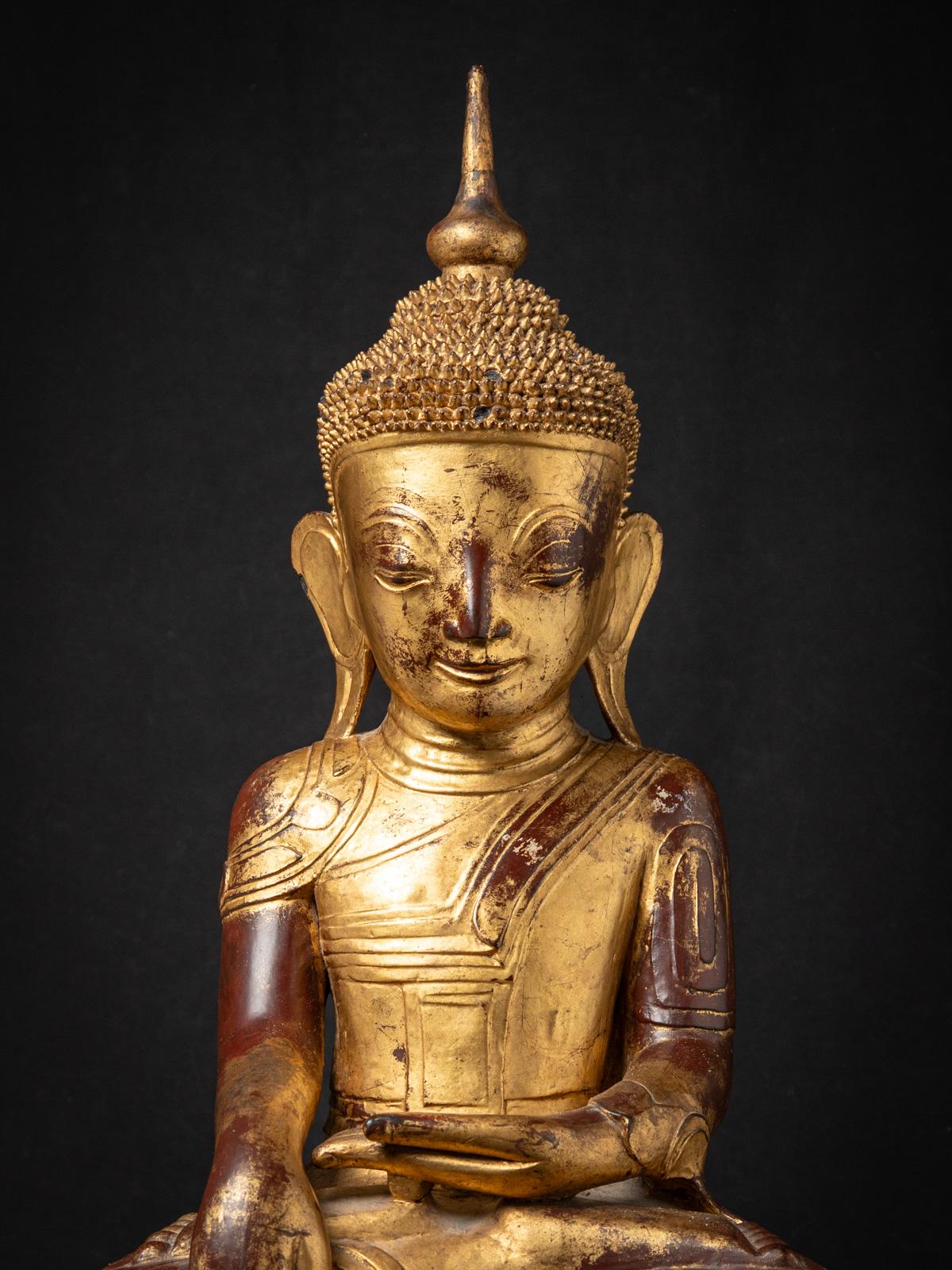 The Antique wooden Burmese Shan Buddha is a remarkable and spiritually significant artifact originating from Burma. Crafted from wood, each statue stands at 91,5 cm in height and measures 48,5 cm in width and 27 cm in depth. 

Created in the 18th