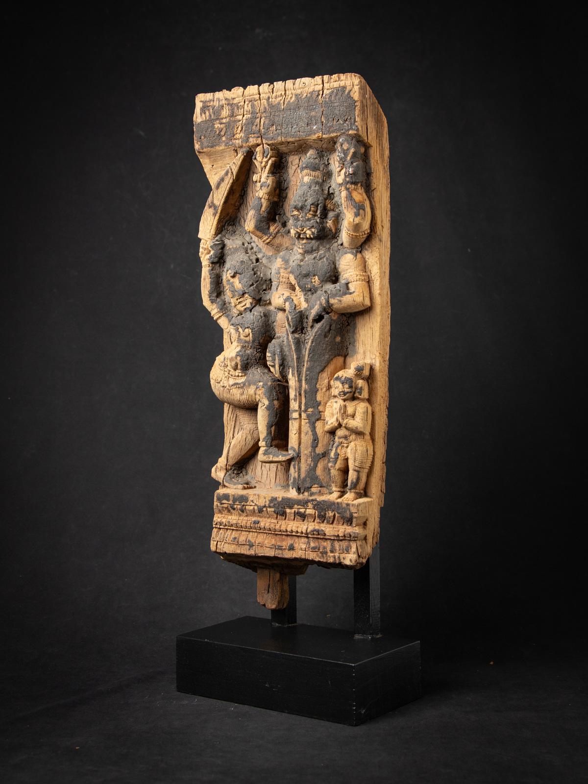 Explore the rich heritage of Indian temple art with this antique wooden Indian temple panel, a stunning 18th-century artifact originating from an antique temple chariot. Crafted from solid wood, this intricately carved panel stands 63.8 cm high,