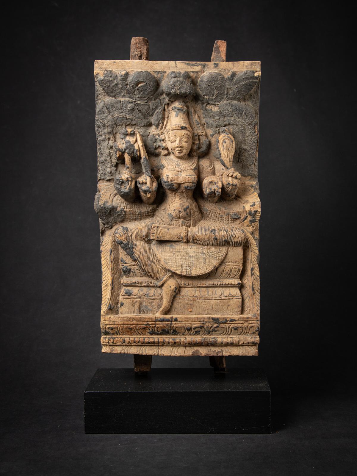 This antique wooden Indian temple panel is a rare and exquisite 18th-century artifact originating from an antique temple chariot in India. Expertly carved from high-quality wood, this sacred temple panel stands 53.5 cm high, 24.8 cm wide, and 12.1