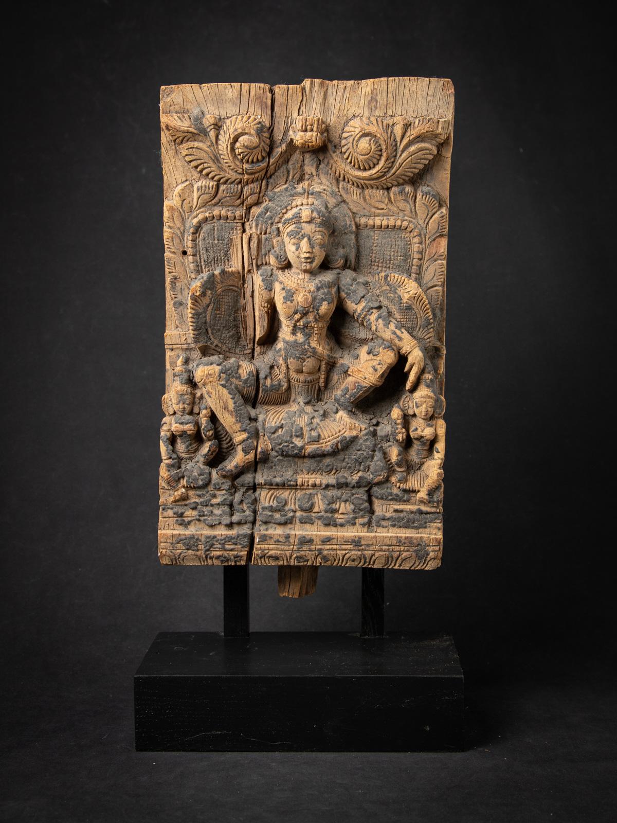 Step into the sacred legacy of Indian temple artistry with this Antique wooden Indian temple panel, a rare 18th-century relic originating from a historic Temple Chariot (Rath) in India. Measuring 51.3 cm high, 25.1 cm wide, and 13.4 cm deep, this