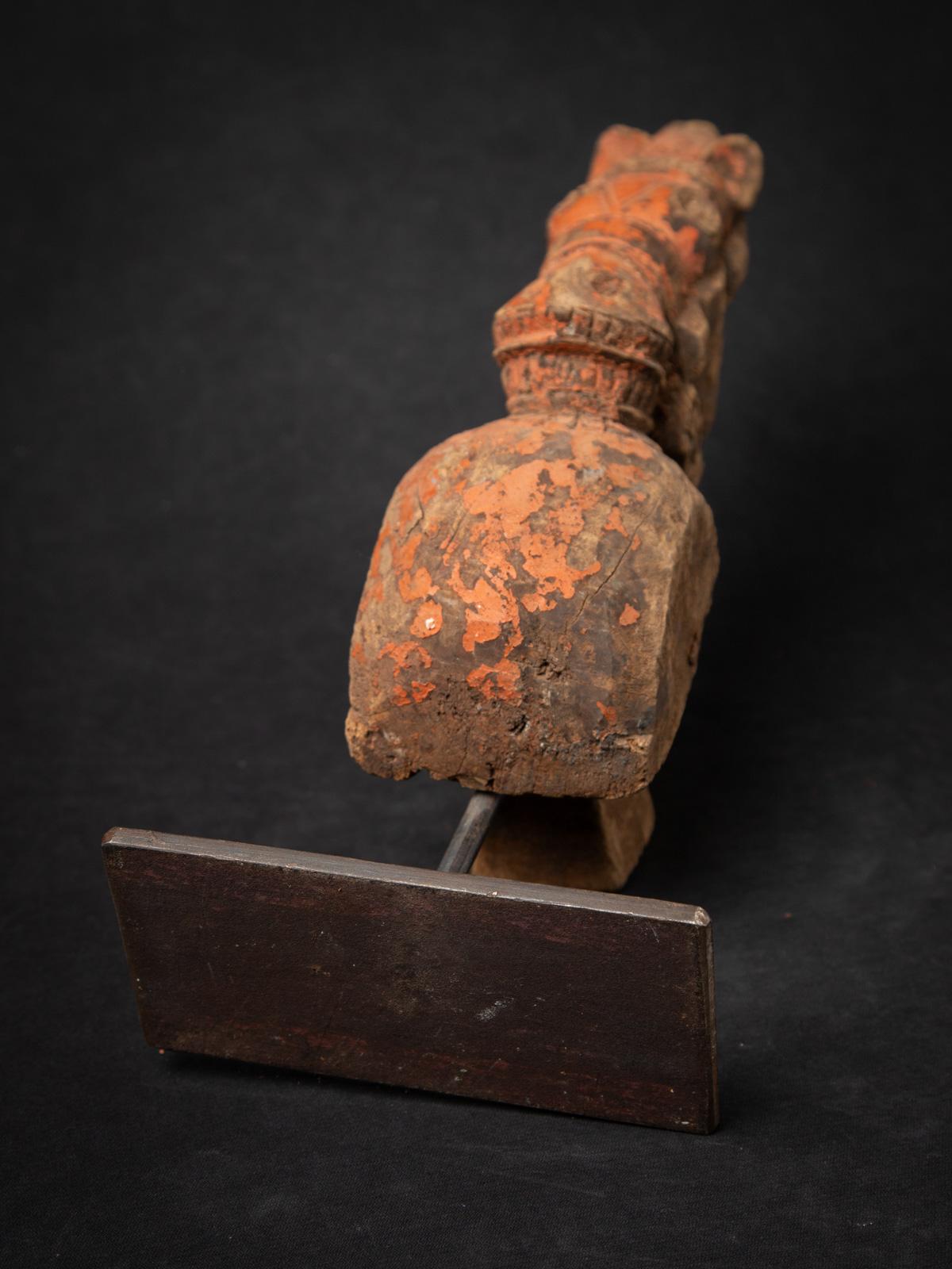 The Antique wooden temple fragment of a Horse head is a remarkable and significant artifact originating from India. Crafted from wood, each statue stands at 37,5 cm in height and measures 15,4 cm in width and 16,8 cm in depth. 

Created in the 18th