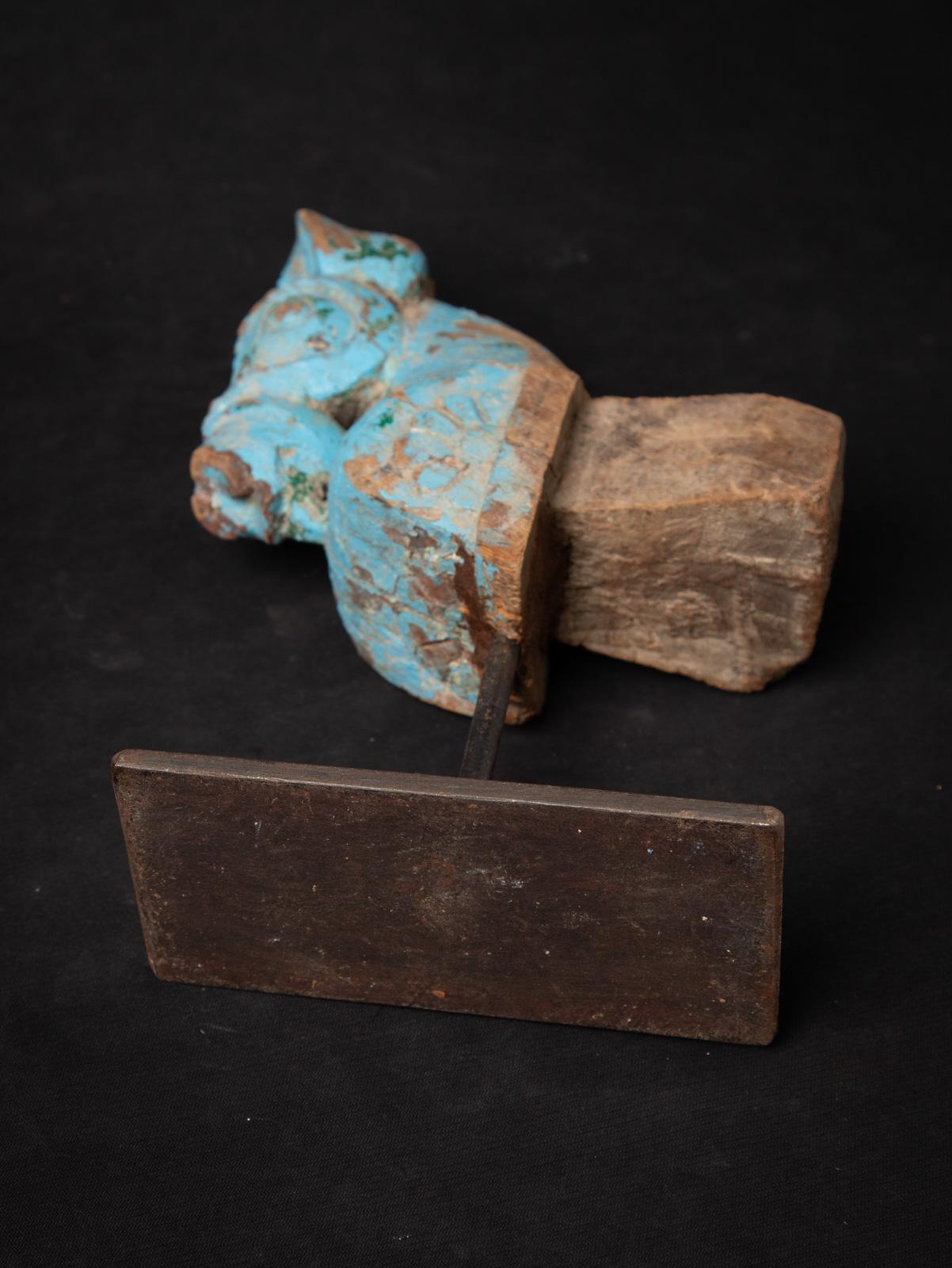 This extraordinary antique wooden temple fragment depicting a horse head is a rare and captivating artifact from 18th-century Burma (Myanmar), offering a glimpse into the rich artistic and spiritual heritage of the region. Carved from wood with